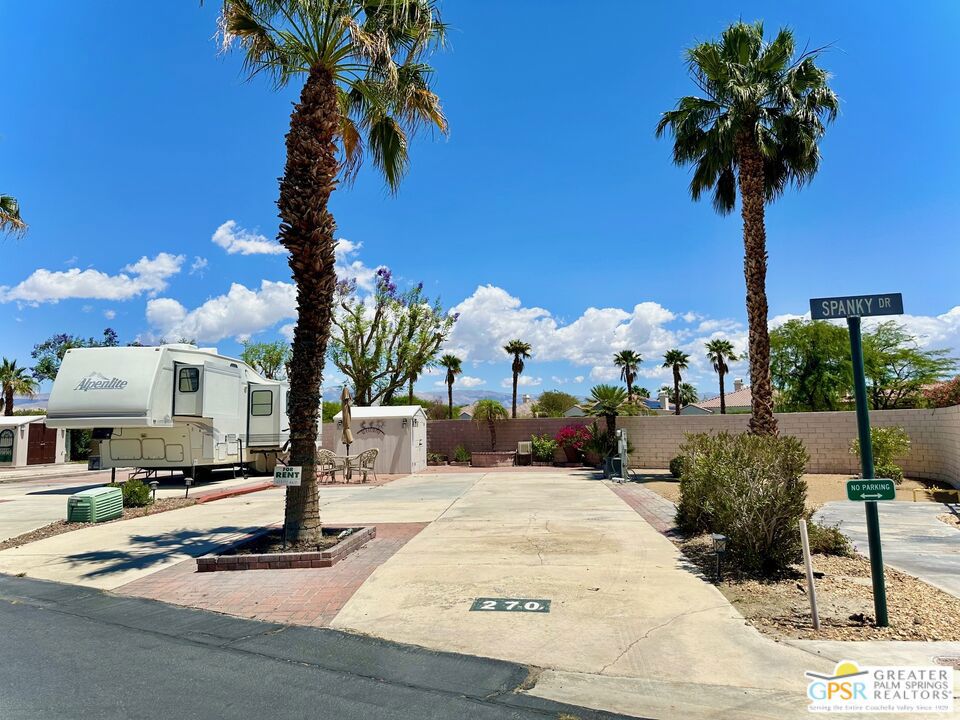 Located on the highly desirable year-round occupancy side of Desert Shadows RV Resort, this premium RV lot offers the rare opportunity to enjoy full-time desert living, something not available throughout the entire resort. With spectacular views of the surrounding mountains and the clubhouse. You won't find a condo or small home in the Palm Springs area at this price point where you own the land, making this an unbeatable value whether you're seeking a seasonal escape, a full-time residence, or a long-term investment. Beautifully landscaped and thoughtfully equipped, the lot features a privacy wall and a large shed for storage. Desert Shadows is a vibrant gated 55+ community with 460 individually owned lots and some of the best amenities in the Coachella Valley. Residents enjoy access to six heated pools, including an Olympic-sized lap pool and an indoor pool, along with spa and sauna facilities. The resort also features sunken, lit tennis and pickleball courts, indoor shuffleboard, a full gym, a woodshop, card and hobby rooms, a putting green, a dance studio, multiple picnic areas, and a grand 16,000 sq. ft. ballroom hosting events and activities year-round. Low monthly HOA dues of just $420 include water, trash, sewer, basic cable, clubhouse Wi-Fi, recycling services, and professional landscaping around your unit, providing both convenience and peace of mind. Don't miss out on this exceptional opportunity to own a prime lot in one of the desert's most well-appointed and welcoming communities. Contact us today to schedule a tour or request more information!