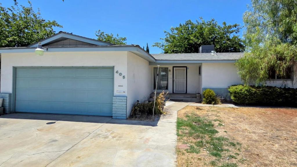 Welcome to 405 N. Santa Ana St., a cozy 3-bedroom, 2-bathroom home in the heart of Los Banos. This 1,164 square foot residence sits on a generous 9,148 square foot lot. The kitchen features tile countertops, an electric oven, and a refrigerator, perfect for your cooking needs. Enjoy a separate family space ideal for a home office or entertainment, along with a dining area in the living room for versatile gatherings. The home offers carpet flooring, a fireplace for cooler evenings, and central air conditioning for year-round comfort. The laundry area is conveniently located in the garage, which also provides space for two cars. Located within the Los Banos Unified School District, this home is a fantastic place to settle in! Call the Listing agent for a personal showing.