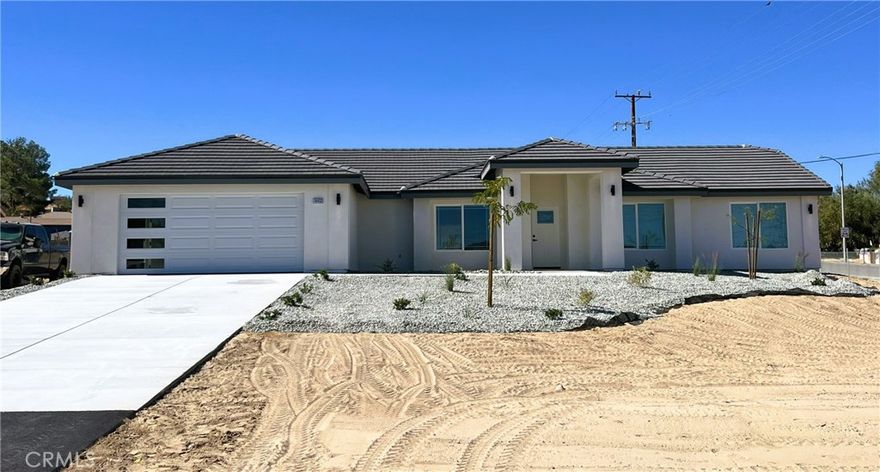 New Construction Home in Victorville on a large .41 ac lot. 1,871 square foot custom home with 4 bedrooms, 2 bathrooms and a 2 car garage. Upon entering the home, you are greeted with a large, open and inviting great room. Just off the great room is the dining area and beautiful kitchen. Gorgeous countertops, stainless steel appliances, full backsplash and a raised bar area highlight the kitchen. Just off the great room on the garage side is access to the garage via walkthrough laundry area. Laundry room has plenty of cabinets and room to customize specific mud room needs. Next to the laundry room is the Master Bedroom, with large walk in closet providing plenty of shelves and racks, and the Master Bathroom with double sinks, tub and walk-in shower. On the opposite side of the Great Room is a hallway leading to three additional bedrooms and the secondary bathroom, complete with the convenience of double sinks. Outside the secondary bathroom is a nook with cabinets and countertop. All bedrooms have closets with shelving and multiple racks. The backyard has plenty of room for your vision and comes with patio and patio cover. Added bonuses also include window coverings and Solar Panels, both included in asking price. Don't pass on your opportunity for a great new construction home at a great price. Adjacent New Construction home available as well. Buy both and have a family compound! Homes will be available for private walkthroughs starting October 9. Call or text listing agent to schedule. Will be move-in-ready by the end of the month.