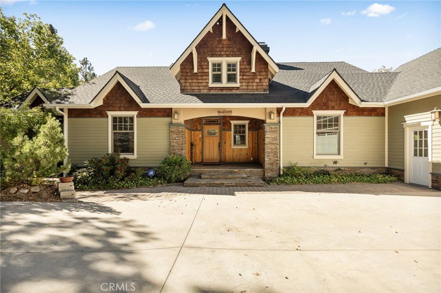 Stunning Craftsman home in the special enclave of Smiley Park. If you are seeking refuge from the city, Smiley Park is the place to be - moderate mountain climate, convenient location for commuting to the valley, and spectacular panoramic views from San Gorgonio to the ocean. Convenient one level living, timeless and classic finishes at every turn, and pride of ownership throughout. The great room offers tranquil forest views with an open floor plan to the kitchen and dining area. There is a large office/nursery connected to the spacious primary suite and bathroom. The primary bathroom features a jetted Jacuzzi tub, a stand alone shower, his and her vanities, a walk-in closet, and a private toilet room. There is also a private deck accessible from the primary bedroom and bathroom. The great room and dining room both have access to the exterior deck, offering beautiful forest views. The garage is over 1200 sq ft - great for hobbies, woodworking, car enthusiasts, and/or boat storage. The garage also has 2 roll-up garage doors for pass-thru convenience. Also included above the garage is an ADU, separated from the main house for privacy and quiet. The ADU is well appointed and has efficient use of the  space. Beneath the house is a large storage area with the potential for adding more square footage. To ensure the quiet and solitude of Smiley Park, short term rentals are not allowed. HOA benefits include road maintenance, snow removal, access to clubhouse, the swimming pool, and social events. Property is situated on just under an acre of land and adjacent to greenbelt. Seller may consider carrying paper for Qualified buyers. Call today and schedule a tour, whether you are looking for a part time retreat in the mountains, or a full time transition to mountain time, this special property is worth the trip!