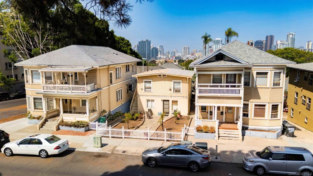 Pleased to present 904-14 24th Street, an exceptional 8-unit apartment complex in the Western Slopes of San Diego’s vibrant Golden Hill neighborhood. Built in 1910, this historic property offers timeless charm and substantial value-add potential, with a coveted Walk Score of 89 reflecting its pedestrian friendly location. Spanning two parcels totaling 7,609 square feet and featuring approximately 5,760 rentable square feet, the asset boasts a diverse unit mix: one 2-bedroom/1.5-bathroom unit, three 2-bedroom/1- bathroom units, two 1-bedroom/1-bathroom units, and two studios (one non-conforming). The interiors have been thoughtfully maintained, showcasing built-in storage, vaulted ceilings, original hardwood floors, and abundant natural light from large windows. Investors can capitalize on untapped upside through targeted renovations and restorations, positioning the property to achieve market-leading rents and enhanced cash flow. Unused lot spaces between the buildings could allow for the potential construction of an ADU further increasing density and rental income. Ideally situated less than a block from Broadway, residents enjoy seamless access to Golden Hill’s eclectic dining, shopping, and cultural scene, with Balboa Park and major freeways (I-5 and SR-94) just moments away. This rare offering represents a prime opportunity to acquire a stabilized, income-producing asset with significant rental growth in one of San Diego’s most sought-after submarkets.