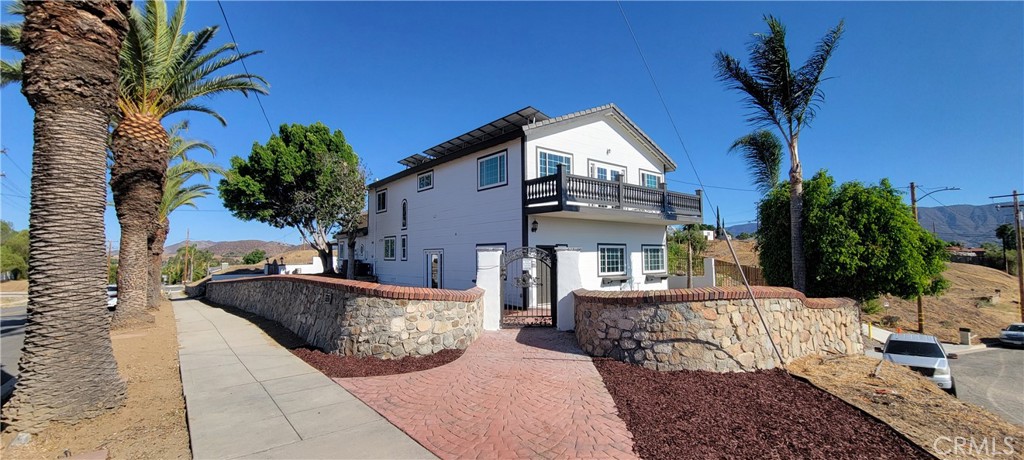 R E M O D E L E D . Beautiful upgraded house in a corner lot, with a breathtaking view of the lake,, the mountains and city lights from the balcony on the second floor. The house is located in the historic downtown of Lake Elsinore. Your next home features 4 bedrooms,1 is at the first floor. The living room it is xtra large, perfect for family reunions , formal dinning room, that connect to a large upgraded kitchen. Upstairs you have 2 bedrooms plus the master bedroom , the walking closet it has an island. From the balcony you have a great view. You have to see it to believe it. The property is located in a family are, close to schools, to shopping centers, to restaurants , with very easy access to freeway 15. YOU MUST SEE IT.