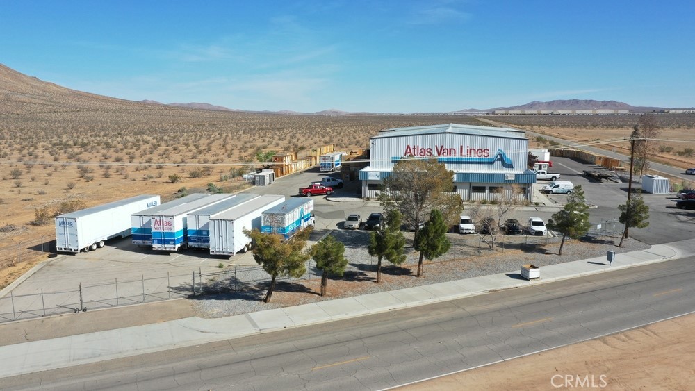 This ±29,615 square foot industrial facility is in the heart of Apple Valley’s Industrial Specific Plan, one of the most dynamic and rapidly expanding industrial zones in Southern California. Situated on 3.27 acres, the property has operated as a transfer and storage center for a highly successful business with over 40 years of proven operations—underscoring the functionality, reliability, and strategic value of this location.
Designed to meet the demands of today’s industrial users, this state-of-the-art building offers a versatile layout ideal for logistics, warehousing, manufacturing, or distribution. Key features include expansive clear-height space, multiple access points for efficient loading and unloading, and ample yard space for vehicle or container storage.
Strategically located just minutes from the I-15 Freeway and the Apple Valley Airport, the property offers excellent regional connectivity for supply chain and distribution operations. It also benefits from its position within the Apple Valley Industrial Specific Plan, where over 12 million square feet of industrial development is entitled and underway—positioning the area for significant economic growth and infrastructure investment over the next five years.
With its robust infrastructure, prime location, and long-standing operational history, this facility presents a rare opportunity for owner-users and investors seeking a turnkey industrial asset in a high-growth market.
Located within the Apple Valley Industrial Specific Plan; Minutes from I-15 Freeway and Apple Valley Airport; Positioned in a booming industrial zone with 12M+ SF entitled; Ample yard space and truck access for logistics or storage; Ideal for warehousing, distribution, manufacturing; or transfer hub use; Turnkey opportunity in a growing Southern California submarket; Under Replacement Cost; Tenant is open to stay and sign a long term lease.