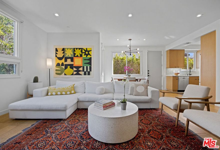 Welcome to this stunning Modern 2 bed, 3 bath townhome in the popular Elk Lofts! Light-filled and beautifully designed, this residence offers a warm, inviting atmosphere with the perfect blend of privacy and open-concept living. The spacious primary bedroom with walk in closet, opens to a large balcony with serene sky and tree views. The generously sized kitchen features Bosch stainless steel appliances, sleek cabinetry, and abundant counter space, perfect for any home chef. Gorgeously engineered hardwood floors flow throughout the bright, airy interior, while skylights enhance the natural light that fills the home. If you must slip in some work at home, there is a charming desk space tucked away, upstairs. This unit includes two side-by-side parking spaces in the subterranean garage, along with the home's own huge storage area. Perfectly situated in the only 6 unit building, tucked behind trees, residents enjoy the short proximity to The Americana, The Galleria, and top-rated schools making this area prime! This home is an absolute must-see!