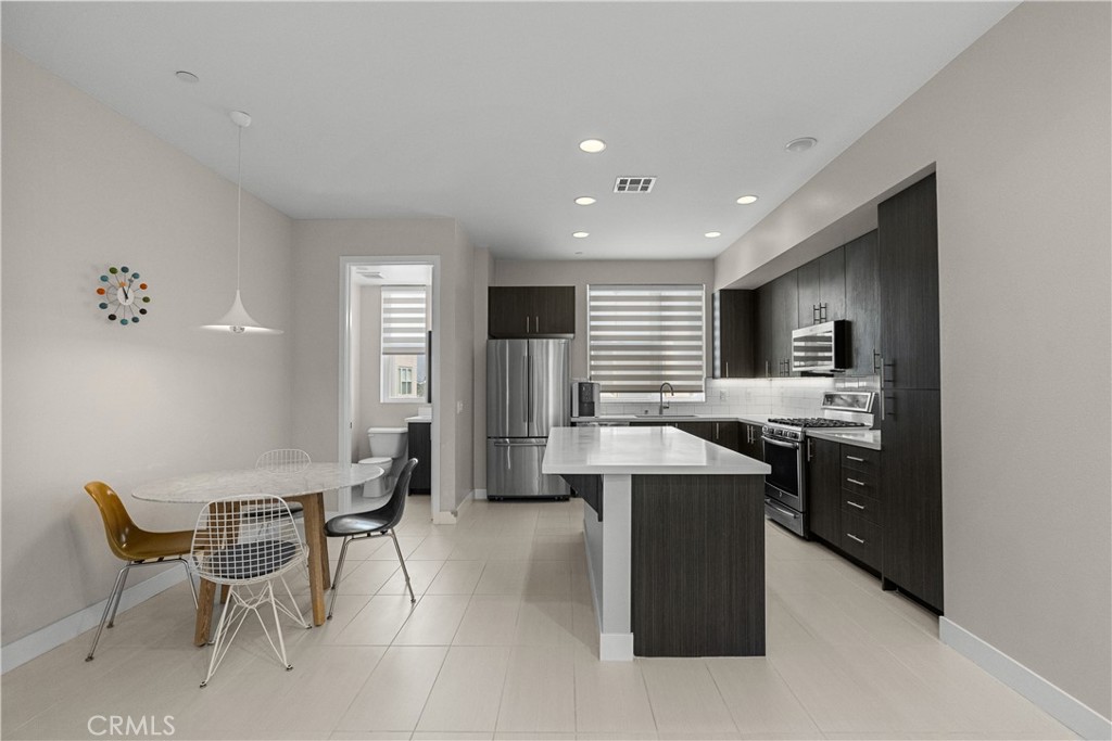 Welcome to Unit 705 at 2753 Waverly Dr – an exquisite 2-bedroom, 2.5-bathroom townhome, featuring an attached 2-car garage equipped with a Tesla charger. In the heart of Silver Lake, within a secure gated complex, this residence exudes a serene ambiance with abundant natural light, expansive interiors, and a host of impressive amenities. Upon entry, expansive windows flood the interior with radiant sunlight, accentuating the soaring ceilings and fostering an inviting, spacious atmosphere. The thoughtfully designed open floor plan seamlessly blends the living and dining areas, creating an ideal space for entertaining guests or simply relaxing with loved ones. The sleek, modern kitchen boasts top-of-the-line stainless steel appliances, making it a haven for culinary enthusiasts. This townhome offers two luxurious primary bedrooms, each complemented by its own lavish ensuite bathroom, ensuring utmost privacy and comfort. The attached two-car garage not only provides secure parking but also includes a convenient laundry area, enhancing daily convenience. Residents of the gated "Latitudes" complex enjoy an array of resort-style amenities, including a refreshing swimming pool and rejuvenating spa facilities. The prime location offers easy access to an eclectic mix of local shopping venues, stylish boutiques, delectable dining options, and cultural attractions that enrich the vibrant Silver Lake community. For outdoor enthusiasts, the nearby Silver Lake Reservoir presents picturesque views and serene walking trails, while the bustling local farmers' market offers an abundance of fresh produce and artisanal goods to savor. Don't let this exceptional opportunity pass you by – seize the chance to make this meticulously crafted townhome your new sanctuary in the heart of Silver Lake, where luxury meets convenience and style meets comfort.