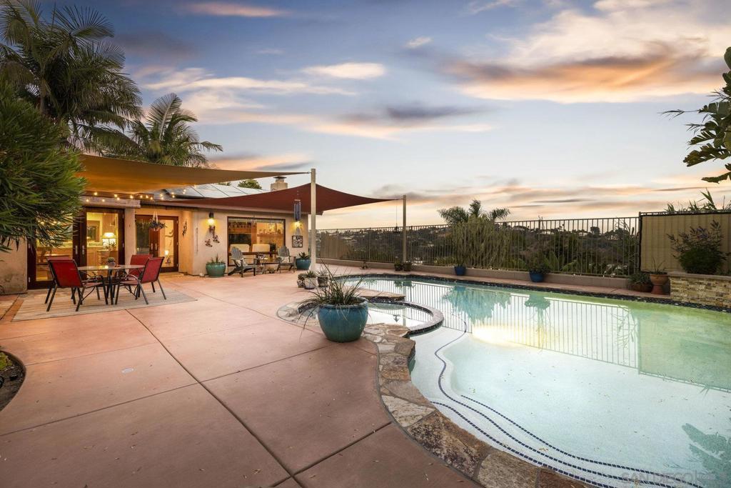 Reminiscent of a Santa Fe Pueblo, this stunning 3-bedroom, 3-bath home in Oceanside’s historic Loma Alta neighborhood is a coastal dream come true. Thoughtfully remodeled in 2022, the home features an open-concept living area that flows seamlessly to the backyard, where you’ll enjoy sweeping views of the Loma Alta Creek valley and surrounding hillsides.Multiple French doors invite in the ocean breeze, while solid cherrywood cabinetry, custom kitchen finishes, and solid wood doors throughout add warmth and craftsmanship. To greet your guests, the xeriscape front yard, enhanced with fruit trees, is both beautiful and water-wise.Out back, a resurfaced pool (2019) provides the perfect private oasis—ideal for entertaining, stargazing, or simply relaxing with a good book. Wildlife sightings add a touch of natural magic to the space.Additional highlights include a separate office space, custom walk-in closet built-ins, and an impeccably clean garage with a built-in workstation so pristine, you could serve dinner on it.This one-of-a-kind home blends character, comfort, and coastal views in one of Oceanside’s most beloved neighborhoods.