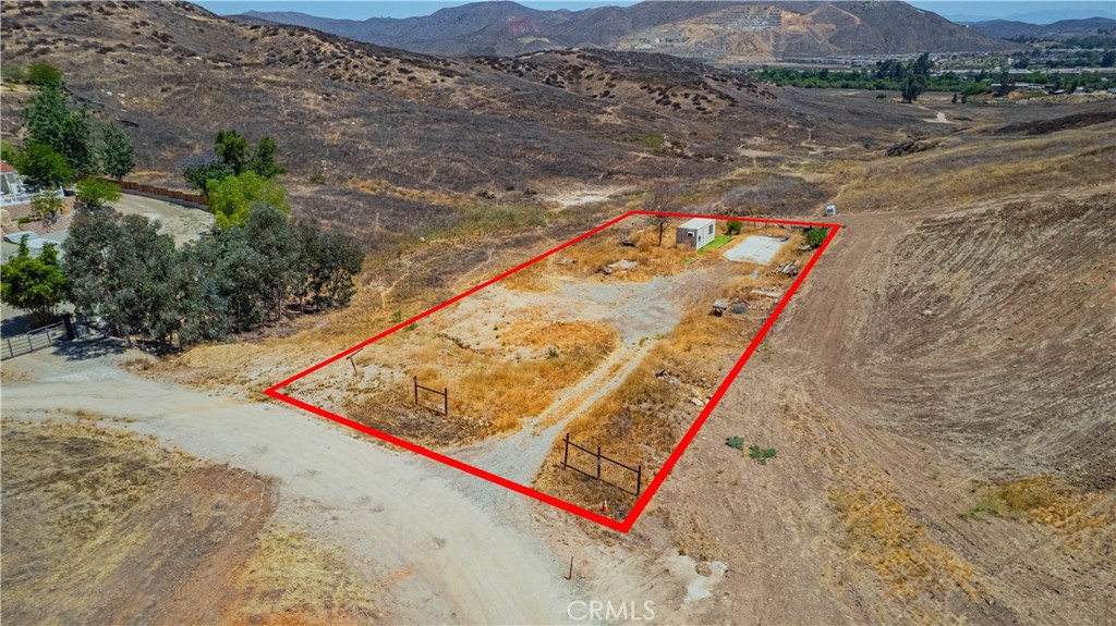 2 parcels sold together, .56 acres, with a concrete pad, views, and privacy. Desirable location in the hills, yet close to schools and shopping. Build a home and garage, add fencing for privacy and enjoy country living. 1.8 miles to the 15 freeway. Homes near by, dirt driveway to the property. Buyer to call City of Lake Elsinore for permits and fees. Priced to sell so you can start your own sanctuary, no HOA, low taxes, and few neighbors. Close to Lake Elsinores' natural freshwater lake. Ski or fish when your need something fun to do close by.