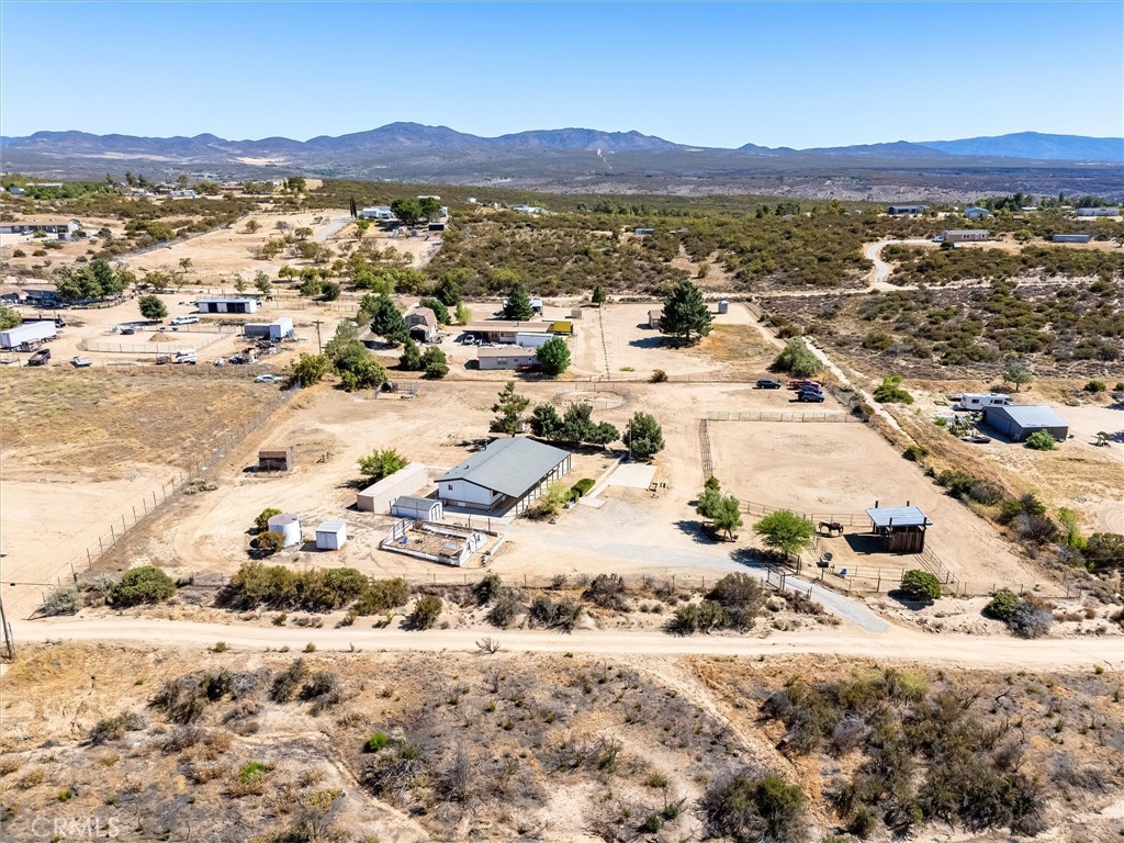 WANT YOUR OWN HORSE PROPERTY that's close to town, but not TOO close? Then take a look at 54197 Scouts Ln, just 40 minutes or so from Old Town Temecula!!! Over 2.5 acres, FULLY FENCED, with HORSE CORRAL, LARGE ARENA, ROUND PEN, GOAT PEN, plus CHICKEN COOP, all for a price you can afford!! The main residence is a comfortable 1,440 square feet and includes 3 bedrooms, 2 full bathrooms, plus an office/den (possible 4th bedroom). Great Room off the entry has high vaulted ceilings, fireplace, and spacious kitchen with island. Well has newer plumbing. SHIPPING CONTAINER WILL STAY, so you have plenty of room for all of your stuff!! VETERANS - ASK ABOUT ASSUMING THE CURRENT VA LOAN - 3% Interest Rate!!!!!!!!! STUNNING VIEWS include GORGEOUS SUNRISES AND SUNSETS!!!!! Minutes from Cahuilla Resort / Casino and just a short drive to Wineries, Pechanga Resort & Casino, Shopping, Galway Downs, and all that the TEMECULA VALLEY HAS TO OFFER!!! This place will serve as an ideal base for exploring all of SW Riverside County. Make it your main home or a weekend getaway. Either way - YOU NEED TO JUMP ON THIS ONE BEFORE SOMEONE BEATS YOU TO IT!!!!!
