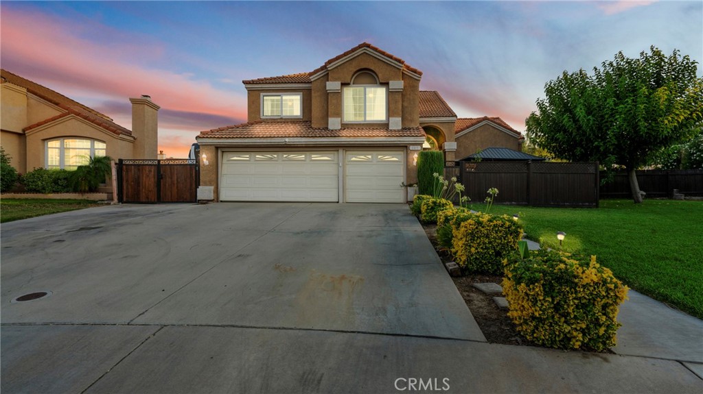 Welcome to 649 Anthirium Ave, a beautifully upgraded 4 bedroom, 2.5 bath home located in one of Perris most desirable low tax zones with no HOA. This home offers 1,829 square feet of well maintained living space and sits on one of the largest and most premium lots in the neighborhood, estimated by the seller at approximately 25,000 square feet. (Tax records reflect 0.35 acres; buyer to verify.) The gated Zen style front porch offers a peaceful and private entrance that sets the tone for this unique property.
Inside, you’ll find soaring ceilings, natural light, and dual living areas, one with a custom stacked stone fireplace and wood mantel, the other ideal for relaxing or entertaining. The kitchen is equipped with rich espresso cabinetry, granite countertops, a stylish backsplash, stainless steel appliances, and a movable central island prep station, all with clear views into the backyard. The adjacent dining room features modern lighting with charming designs that make it perfect for gatherings.
Step outside into a resort style backyard designed for entertaining and everyday enjoyment. You’ll find a private pool and jacuzzi, built in BBQ kitchen, covered alumawood patio with recessed lighting and ceiling fans, a beach sand playground, fruit trees, a putting green, and cemented RV parking with gated access. The lot also offers strong ADU potential for future expansion or multigenerational living.
Additional highlights include a 3 car garage, paid off solar system that will be paid by the seller at the close of escrow, and approximately $250,000 in thoughtful upgrades throughout. Whether you’re looking for flexible living, a place to raise a family, or an entertainer’s dream home, this one delivers.