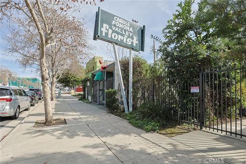 Photo of 440 W Holt Ave, Pomona, CA 91768 (MLS # RS26037101)