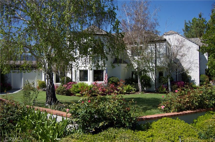 Nestled on over an acre in one of Agoura Hills’ most desirable cul-de-sac enclaves, this impressive residence spans approximately 4,726 square feet with 5 bedrooms and 4 baths. 



A grand, light-filled foyer greets you as you enter, flowing into a formal living room and framed by soaring ceilings and generous windows. Beautiful hardwood, stone, and tile finishes run throughout. The formal dining room includes a butler’s pantry for convenience. In the heart of the home, the chef’s kitchen features stainless appliances, granite countertops, a walk-in pantry, and a cozy breakfast nook that opens seamlessly to the family room, complete with a stone fireplace and views out to the yard.



On the main floor, there is also a guest bedroom with an en suite and a dedicated office or study, perfect for work-from-home needs. Upstairs, the primary suite offers a private balcony, serene views, a stacked-stone fireplace, and a luxurious spa-style bath with a large walk-in closet, soaking tub, and separate shower. Two additional well-sized bedrooms complete the upper level.



The outdoor living experience is exceptional: expansive patios and stone decking ideal for entertaining, a built-in BBQ center, brick-accented swimming pool and spa, lush gardens, and expansive lawns. A fully lighted north/south tennis court and an oversized 4-car garage round out the amenities.



With its enviable location, elegant appointments, and vast outdoor space, this property embodies refined Southern California living.