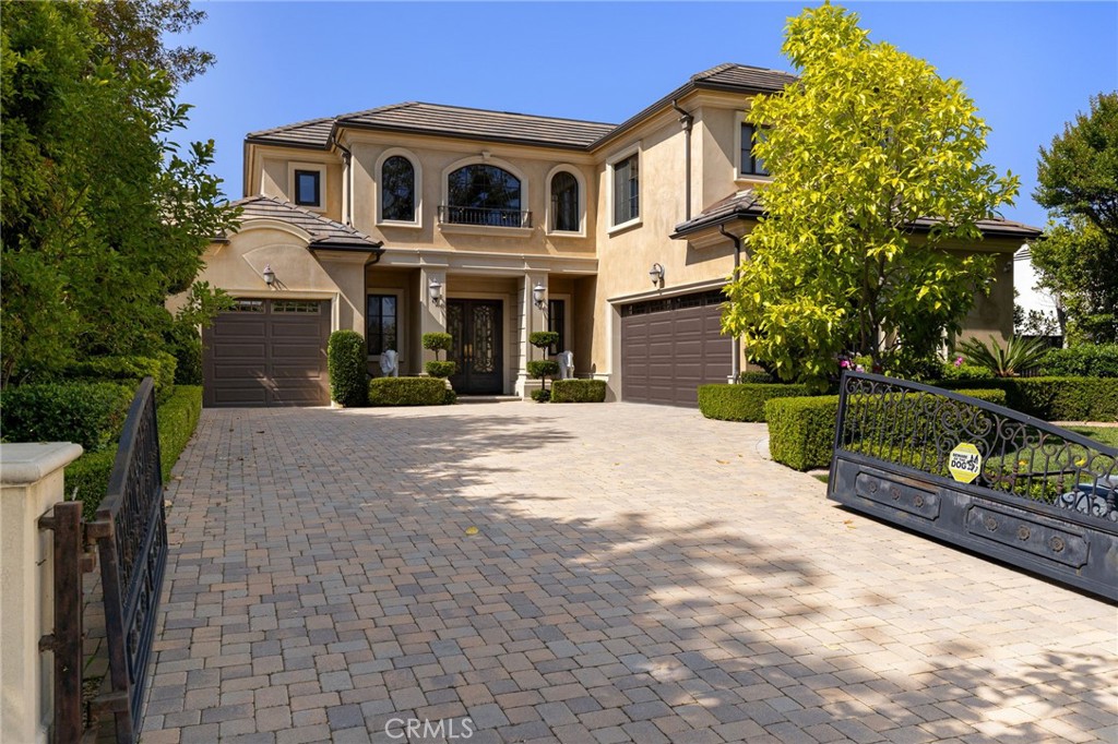 Experience the epitome of refined living in this South-Facing Modern French Estate, privately nestled in one of Arcadia’s highly sought-after Arcadia Unified School District, this stunning custom home was built in 2014 with impeccable attention to detail and an ideal layout for luxurious everyday living and entertaining. Situated on a generous 12,698 square foot lot, this residence offers approximately 6,258 square feet of living space, featuring 5 spacious bedroom suites—each with its own private bathroom—and a total of 6 bathrooms. The elegant primary suite, located on the second floor, includes a wet bar, spa-style bath with Jacuzzi tub, steam shower, and a large walk-in closet, plus a private balcony overlooking the backyard.
A grand entrance with custom wrought iron double glass doors leads into a soaring two-story foyer, accented by a dazzling crystal chandelier and elegant staircase. Designed to impress, the home boasts formal living and dining rooms, a richly appointed library with coffered ceilings, a spacious family room, upstairs loft, and a state-of-the-art home theater. The gourmet kitchen is a culinary masterpiece with a center island, walk-in pantry, high-end appliances, and a separate wok kitchen. Enjoy casual meals in the sunlit breakfast nook or entertain in style with the adjacent wet bar.
Outside, the meticulously landscaped backyard is your private oasis, featuring a resort-style saltwater pool and spa, perfect for relaxing or hosting. A 3-car attached garage adds convenience and functionality to this exceptional home.