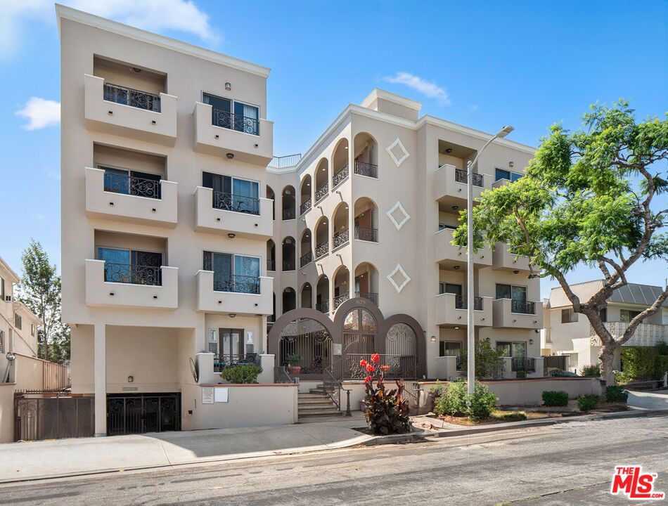 Experience modern living in this stunning front-facing 3-bedroom corner residence, designed to maximize light, space, and comfort. With two street-facing balconies and windows in every room, the home is bathed in natural sunlight throughout the day.The spacious primary suite offers a walk-in closet with bonus storage, two additional closets, and a spa-like bath featuring dual sinks, a soaking tub, and a separate glass-enclosed shower. The open-concept living room is anchored by a cozy fireplace and dining area, flowing seamlessly to a private patio ideal for entertaining.The beautifully remodeled kitchen boasts a built-in pantry, ample cabinetry, and modern finishes, perfectly complemented by new white oak wood flooring and freshly painted interiors. Two built-in desks at the entry provide a dedicated work-from-home setup, while in-unit laundry adds everyday convenience.Additional amenities include a spacious communal patio and gated two-car tandem underground parking.