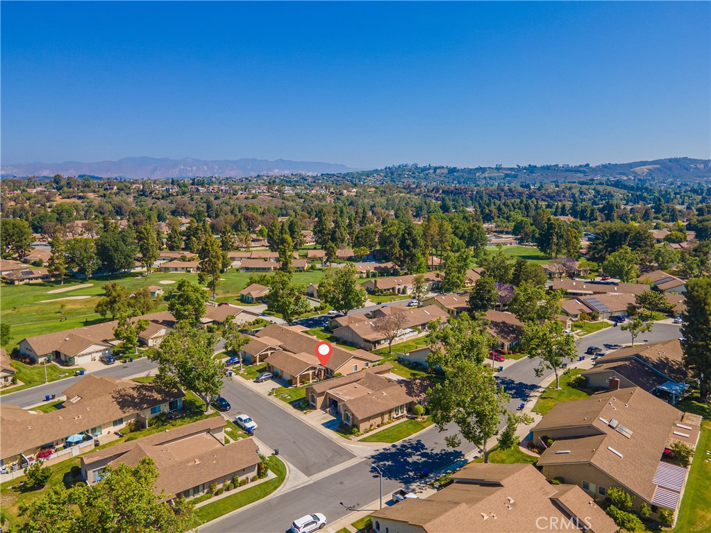 Welcome home to a peaceful retreat in Leisure Village, Camarillo's premier active 55+ community. This charming 2-bedroom, 2-bathroom home is perfectly located on a quiet street, away from busy streets, plus easy access to all the amenities you desire. Step inside to an inviting single-story layout filled with natural light, featuring high ceilings and a versatile bonus room perfect for a den or dining area. You'll love the serene mountain views and the home's superb location, just a short walk from the recreation center, sparkling pool, and 18-hole golf course. Live a vibrant, worry-free life in Camarillo, a city renowned for its great weather and mild year-round climate. Enjoy the fantastic selection of amenities Leisure Village has to offer. The comprehensive HOA fees cover everything from all-risk insurance and exterior maintenance to water, internet, landscaping, 24-hour security, and even free on-site RV storage. Experience the ideal blend of peaceful living and active community life, conveniently located near shopping, dining, and charming Old Town Ventura. Don't miss out! Schedule a showing today.