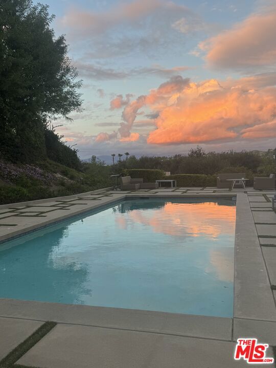 Views, Views .Located in classic Calabasas, minutes walk to the lake and the Commons. This beautiful Home with Views has 4 Bed , 41/2 Ba , 3000 Sqft. . Upgraded many times over the years. Magnificent backyard with beautiful landscaping and a huge pool, open views of green belt, mountains and city light from upstairs main Bedroom . Outdoor BBQ and fireplace. 2 car garage with an extra parking space on the side of the house. Beautifully gated . Available for short term lease ( minimum of 3 months) . Furnished or unfurnished. Lease price is for unfurnished and long term lease. Lot size of approximately 11000 sqft. This home is a surprise Gem. Please contact the listing agent.