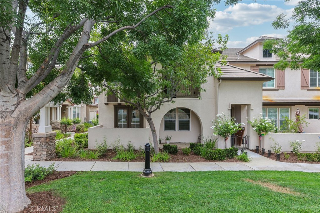 Welcome to one of the largest and most desirable floorplans in the beautiful West Creek community of Valencia! This immaculate 3-bedroom + loft, 2.5-bath end-unit townhome offers an ideal blend of space, style, and location. Perfectly situated right across from the expansive West Creek Park, HOA Amenities, and just steps from guest parking.
Inside, you'll find a spacious open-concept layout with luxury vinyl plank flooring, high ceilings, recessed lighting, and plenty of natural light throughout. The oversized kitchen is a standout feature—equipped with granite countertops, abundant cabinet space, stainless steel appliances, under-cabinet lighting, a slide-in range, built-in microwave, and a deep stainless steel sink. Whether you're entertaining or cooking for the family, this kitchen delivers.
The living and dining areas flow seamlessly to a private front patio, perfect for al fresco dining or a morning coffee retreat. French doors open wide, expanding your living space outdoors. The first level also includes a convenient half bath and a large storage closet.
Upstairs, enjoy a versatile loft space ideal for a home office, media room, or play area. The two secondary bedrooms are generously sized and share a full bathroom with a double-sink vanity. The laundry room is upstairs for convenience and includes both washer and dryer.
The spacious primary suite is located in its own private wing and features a walk-in closet, French doors to a private balcony, and a luxurious ensuite bathroom with dual vanities, a large soaking tub, and a separate walk-in shower. Each bedroom includes ceiling fans, and the home has been thoughtfully updated and maintained throughout.
As part of the resort-style West Creek community, enjoy amazing HOA amenities including three sparkling pools and spas, a clubhouse, BBQ/picnic areas, playgrounds, basketball and sport courts, and miles of greenbelts and scenic paseos. Right across the street, West Creek Park offers one of the best outdoor experiences in the area with its massive play structure, fitness stations, and covered picnic areas. Close to award-winning schools like Rio Norte Jr. High, walking distance to shopping, dining, and with easy freeway access — this location is hard to beat. Schedule your private showing today!