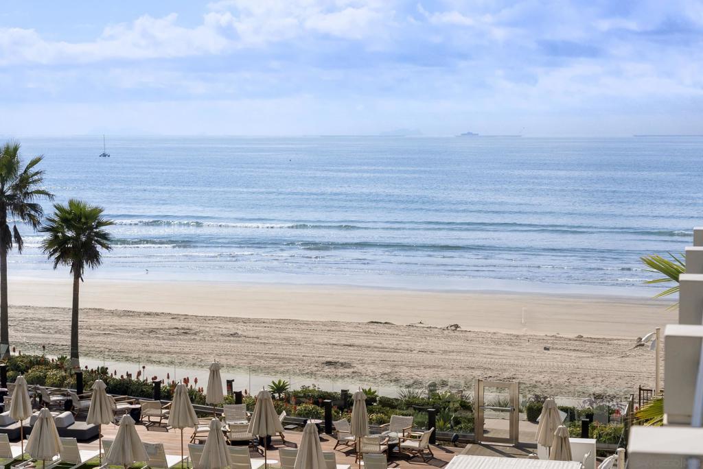 Shore House at The Del presents a rare opportunity to own a luxurious ocean view 2-bedroom, 2-bath residence at the legendary Hotel del Coronado. Residence 26 is the only second-floor home with breathtaking ocean and pool views currently offered for sale, making it a truly special offering. The open floor plan showcases a gourmet kitchen, spacious living and dining areas, and two fireplaces—one in the living room and another on the private balcony—creating the perfect indoor-outdoor retreat. Owners enjoy the unique full-ownership, limited-use model with strong rental potential through the professionally managed program at The Del. Resort amenities include a beachfront pool with cabanas, fire pits, fitness center, valet and concierge services, and direct access to Coronado’s iconic white-sand beach. Experience modern coastal living with the ultimate combination of stunning ocean views, historic charm, and income opportunity—all within one of California’s most exclusive beachfront settings.