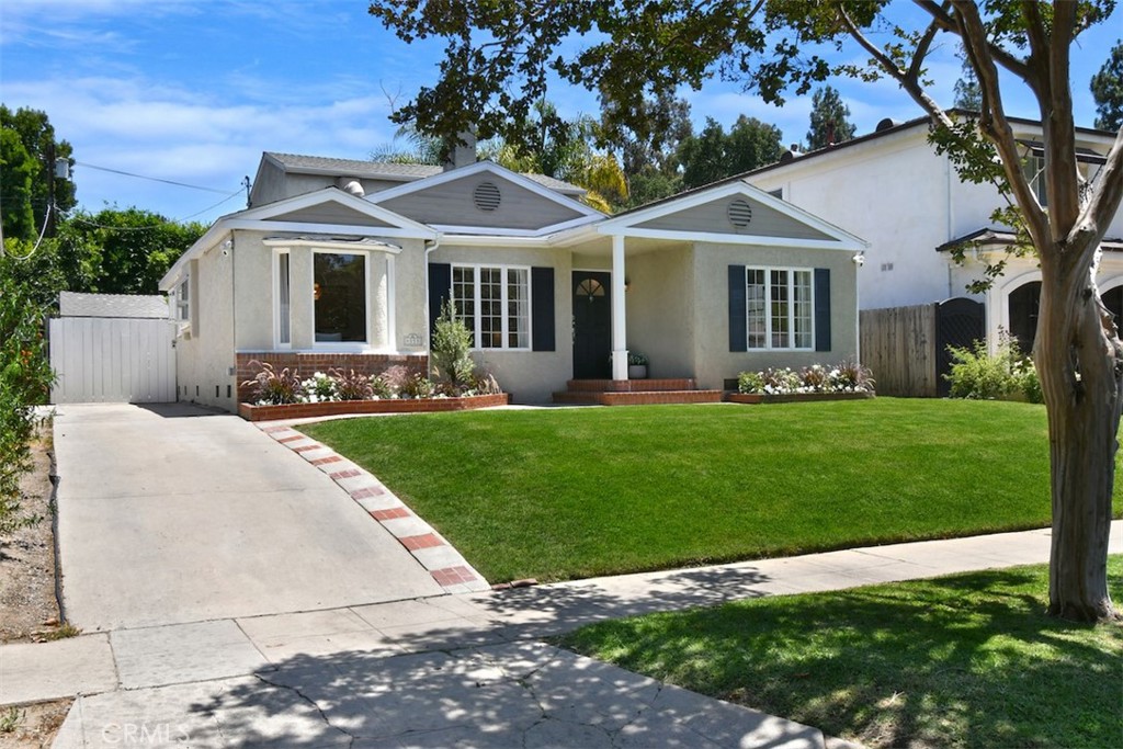 Welcome to this beautifully maintained gem, located in the highly coveted area of Footbridge Square in the heart of Studio City. This timeless home exudes charm with thoughtful updates, offering a perfect blend of classic character and modern comfort for today's lifestyle. Fresh new paint throughout the interior creates a clean, refreshed atmosphere, while original hardwood floors add a touch of timeless elegance. The spacious living room welcomes you with oversized windows that flood the space with natural light, and flows seamlessly with the dining room. Inside, the sunlit flexible floor plan offers a gracious transition from room to room with a wealth of period details that blend beautifully. Relax in the inviting family room by the fireplace, where French doors open to a covered patio—perfect for seamless indoor-outdoor living. Retreat to the expansive Primary Suite upstairs, where high ceilings and natural light create an airy, peaceful atmosphere, complete with views of the stunning backyard. An en-suite bath and large walk-in closet add to the comfort. Three bedrooms downstairs, all with specific and unique design details, round out the comfortable accommodations for family and guests. The crown jewel of the property is the expansive, redesigned backyard—an entertainer’s dream. With a newly redone pool featuring a relaxing baja shelf and spa, this private oasis is ideal for barbecues, celebrations, or quiet evenings under the stars. Surrounded by mature greenery, it perfectly captures the warmth and ease of Southern California living. Situated in the highly acclaimed Carpenter School District, this prime Studio City location offers unbeatable access to top-tier studios, parks, and the vibrant energy of Ventura Boulevard—just moments away from chic dining, shopping, and the new Sportsmen’s Lodge center. Enjoy effortless access to the Westside and major freeways. This is Studio City living at its finest!
