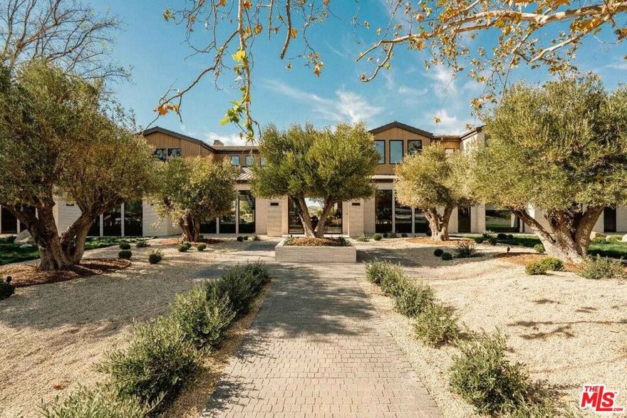 Located on the most prestigious street in Hidden Hills, this ultra-luxury masterpiece, custom-crafted by an Architectural Digest-featured designer, showcases unobstructed views of a protected nature preserve. This one-of-a-kind estate sits on over 50,000 square feet of completely flat, fully usable land, offering unparalleled privacy and exclusivity. Perfectly designed for those seeking a secluded, celebrity-level retreat. The property includes an athlete-caliber wellness center and gym, featuring an indoor in-ground cold plunge and an indoor in-ground hot spa accommodating 12 guests, a sauna, and a steam room. Set in the most desirable section of Hidden Hills, this incredible offering is shown exclusively to qualified buyers by private appointment only.