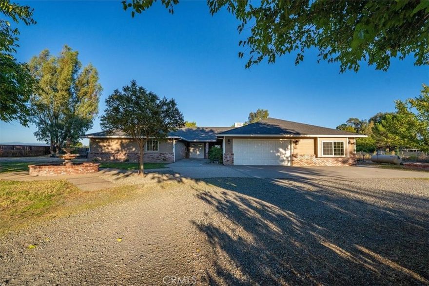 This beautifully remodeled 3,500 sq. ft. home offers versatile living with five bedrooms, including two master suites ideal for in-laws or multi-generational living. County records reflect four bedrooms, but the flexible layout provides an additional room to suit your needs. The south wing features a brand-new, two-zone HVAC system installed in January 2024, while the north wing’s system was replaced in July 2022, ensuring year-round comfort. Energy efficiency is enhanced with an owned 40-panel, 13kV solar system.

The home underwent an update in March 2024, including the installation of 1,100 sq. ft. of authentic Saltillo tile, with an additional 2,000 sq. ft. of tile stored in the garage for future use. Outdoor living is unmatched, with over 1,000 sq. ft. of concrete patio space in the backyard, a cedar hot tub, and more than 30 established fruit trees including fig, prune, apricot, cherry, mulberry, Asian pear, and a variety of citrus. The fully fenced property, complete with a powered gate, offers privacy and security. A two-car garage provides convenience and ample storage. This move-in ready home blends thoughtful upgrades, modern efficiency, and timeless charm, creating a rare opportunity to enjoy comfortable indoor living and abundant outdoor amenities.