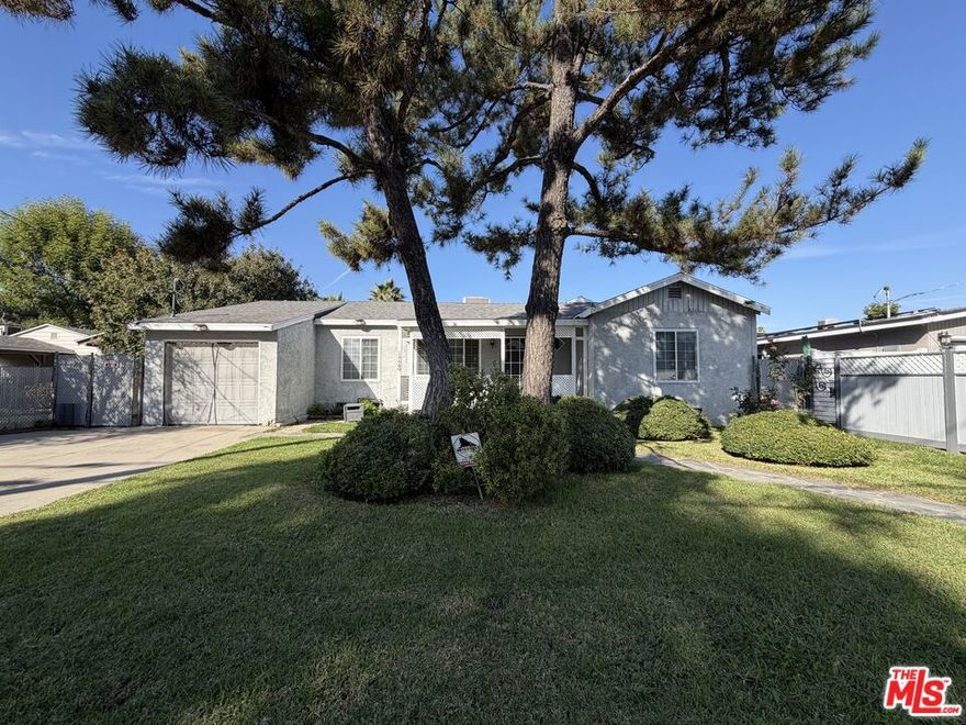 Fabulous Remodeled Gated Single-Story Home! Welcome to this beautifully updated 3-bedroom, 2-bathroom home that perfectly blends comfort, style, and functionality. Featuring wood and tile floors, smooth ceilings with recessed lighting, and an updated kitchen with granite countertops and custom cabinetry. Enjoy both a dining area and a cozy breakfast nook, plus a fireplace that warms the inviting living room. The spacious primary bedroom offers direct access to the huge backyard, perfect for relaxing or entertaining. The home also features a large front yard, a bonus/game room with vaulted ceiling and skylight, and a generous laundry room with extra storage. Step outside to a massive backyard complete with a covered patio, shed, dog run, and lush lawn area  ideal for outdoor gatherings. With ample closet space and thoughtful updates throughout, this home truly has it all. A Must See!