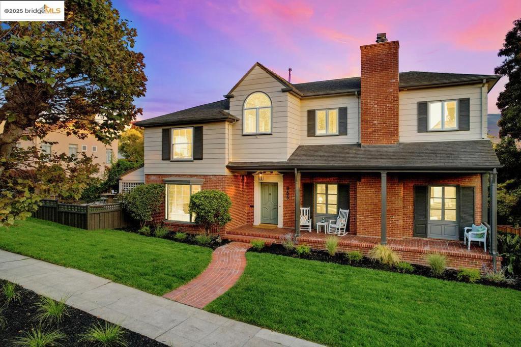 Crocker Highlands Colonial w/ expansive grounds for entertaining + play. Sunny corner lot w/ large formal rms, seamless indoor-outdoor living + fabulous flow. LR features plate glass window framing lush trees, gas FP for the holidays + French doors to a spacious private deck. Adjacent to full BA, a sunny den opens to deck—ideal as office, rumpus rm or guest suite. Eat-in kitchen offers stone counters, farm sink overlooking gardens + luxe appls incl. 6-burner Thermador. DR w/ bay windows perfect for soirées, doors to covered patio + level yard for play. Upstairs: primary suite wing w/ FP, treetop views, renovated BA + walk-in closet. 3 add’l BRs + charming hall BA w/ frameless shower, clawfoot tub + marble vanity. Attached 2-car garage has direct access to lower lvl w/ 5th BR, full BA (ideal au pair) + doors to rear brick patio anchored by magnolia tree. On one of the neighborhood’s most coveted streets, blocks from award-winning elem, Lakeshore shops/restaurants, Sat Farmers Market + Lake Merritt, mins to Bay Bridge + SF