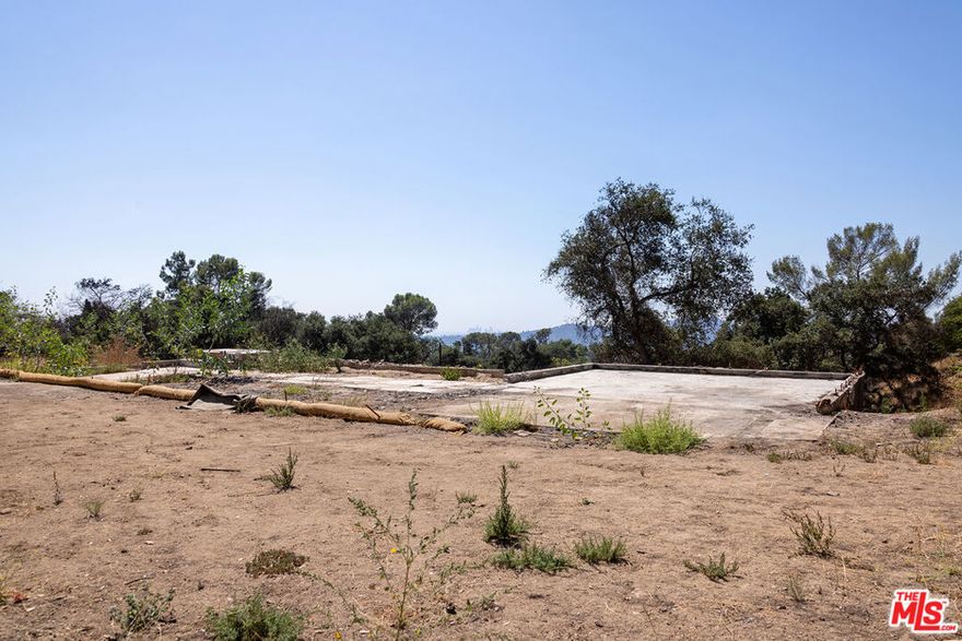 The current owners were originally drawn to 3635 Skylane for its tranquil yet accessible setting, the amount of space and potential the property offered, and its eponymous views that stretch out toward and past the downtown LA skyline. The location allows you to feel as if you're living in the wilderness without being isolated, with Altadena and Pasadena just a short drive away. There's easy access to many hiking trails, including Echo Mountain and Mount Wilson, which offer spectacular views of Catalina and the Pacific. Despite the loss of the home itself (4 Bed + 3 Bath + 3439 sq ft) during the Eaton Fire, some of the property's most desirable assets still remain, and someone with a similar vision can bring it back to life. The sellers had recently added a 40' long pebble finish pool with a 25' baja and a 7' square spa, a custom sport court with overhead lighting, and a new privacy gate. Fencing has been installed to give the new owner clear definition of the lot lines. With nearly 2/3 of an acre set above Loma Alta, 3635 Skylane Dr offers a great deal of privacy for those seeking a place to build their own unique retreat. This quiet enclave has historically been protected from the nuisance of road noise, highways, and public transport, has been populated by friendly and unique neighbors, and feels even more expansive than it is thanks to its open views of the surrounding mountains. This property (and the majority of the street/area) is on Septic. All utilities except gas were available prior to the fire. Phase 1 and 2 debris removal are complete and permitted. Buyer to do their own due diligence and investigations with LA County as to zoning, permitting, and any future building on the property.