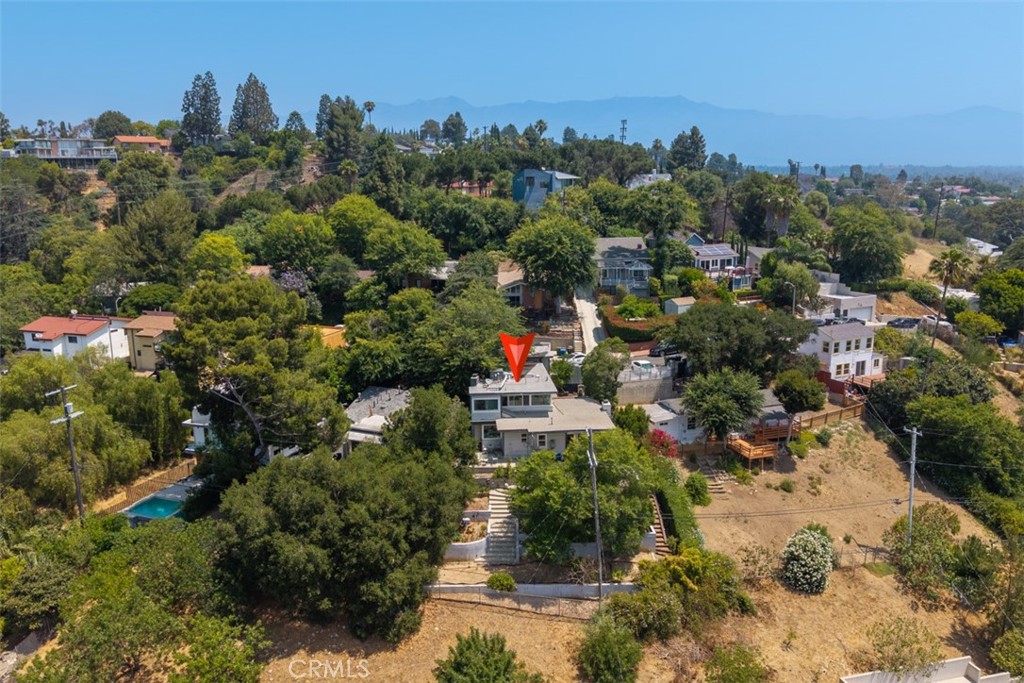 Don’t miss this rare opportunity to own a beautiful 3 bedroom, 3 bathroom home perched near the top of the hill with sweeping south-facing views of the hills and the Los Angeles skyline. Located in El Sereno, just adjacent to South Pasadena, this property blends charm, comfort, and unbeatable location.
Step inside to find gorgeous wood flooring throughout the living space. The versatile layout features a lower level with a spacious living room, a galley kitchen, one bedroom, and a large flexible bonus room — ideal for a dining area, family room, or spacious home office.
Upstairs, you’ll find two additional bedrooms offering privacy and serene hillside vistas. Outside, the backyard offers terraced landscaping and space to create your ideal patio or garden retreat, perfect for relaxing or entertaining while soaking in the view.
A 1-car garage with a hobby room is located at street level, with direct access to the second floor for added convenience.
This gem is nestled in a peaceful, sought-after neighborhood. Come see the view for yourself and fall in love!