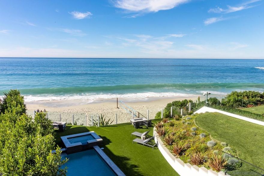 Welcome to this extraordinary newly rebuilt oceanfront estate. "Whispering Sands Beach Estate" is nestled along the pristine sands of the renowned Beach Barber tract. Rare oceanfront pool and spa with private steps leading down to the expansive white sand and crystal blue waters. The .31 acre lot is elevated about 18 feet above the sand. Adjacent to the pool is over 2,200 square feet of brand-new covered decks with 7 person spa, infrared heaters, fireplace and BBQ command center with all the amenities for enjoying entertaining. Exquisite finishes throughout with a smart home system. Large accordion style La Cantina doors compliment the wide plank French white oak flooring throughout.  Taking up the entirety of the 2nd floor sits the main bedroom with a private access to the entertainment deck, dual bathrooms featuring custom walk-in closets, soaking tub and steam shower.2 oceanfront firepits allow for afternoon and evening enjoyment while watching marine life swim and fly by. Large family/flex room downstairs leading out to the pool with  full bathroom, separate entrance and laundry.  La Cantina doors/windows throughout create indoor/ outdoor living flow. Grassy yard, and expansive artificial turf surround the pool, 6 person hot tub and dual fire-pits.  Mature landscaping and electric awnings installed for privacy.  Additional gated motor court for 3 vehicles with ocean views! A unique commercial marine light illuminates the sand and ocean of Whispering Sands Beach, allowing for night beach volleyball, surfing, playing, and all other beach activities that were once only dreams. Walk 2 blocks to shops and restaurants in the Village. Property has Sonos, Doorbird, Lutron & LTS Connect systems.