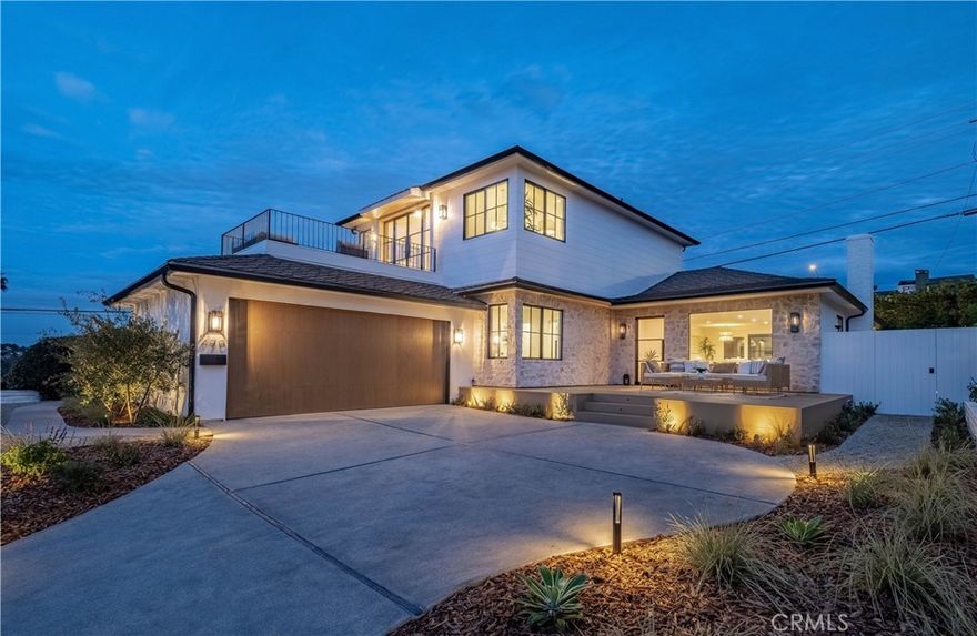 Welcome to a home where design, comfort, and the rhythm of the ocean meet in perfect harmony. Every detail of this high-end remodel was chosen with intention by interior designer Stevy White—to create a space that feels vibrant and inspiring. From the moment you step through the custom Pinky’s Steel entry door, you’re greeted by wide-open spaces bathed in natural light and uninterrupted ocean views from the front door through the living room. The atmosphere is calm yet elevated, with 81/2” wide-plank white oak flooring leading you through thoughtfully curated interiors. The custom rift white oak cabinets in the kitchen are as functional as they are beautiful - a statement in craftsmanship. Outfitted with top-of-the-line Thermador appliances, it’s a space designed for gathering, cooking, and conversation. A walk-in pantry and laundry room keeps everything organized and out of sight. The custom arched bookcase and bar area add warmth and sophistication. A dramatic 12-foot Pinky’s bi-fold door opens to a private backyard oasis with TimberTech decking, ideal for outdoor dining, entertaining, or simply soaking in the peace of your surroundings. Upstairs, the primary suite feels like a boutique hotel, serene and spacious, with its own private deck framed by steel French doors and whitewater views that steal the show. The spa-inspired bathroom is pure indulgence, and a large, custom walk-in closet system completes the retreat. Three additional bedrooms complete the home, including one that also enjoys ocean views. An expansive TimberTech front deck offers more ocean views for enjoying sunsets. The finished garage, with its custom wood door, provides flexibility for storage or a creative space. When you’re ready to explore, Riviera Village is walkable for boutique shopping, local restaurants, and cafes, or head down to the beach and sink your toes into the sand. This home echoes quality in every step; it’s reimagined for modern coastal living. Every sunset here feels like an encore, and every day, a reminder that you’ve arrived exactly where you’re meant to be.