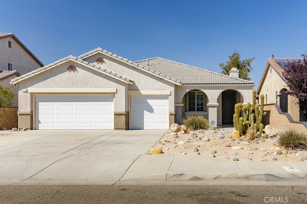 Tucked away on a quiet cul-de-sac, this inviting 4-bedroom, 2-bath home blends functionality with comfort. Step inside to an open floor plan highlighted by a diagonal-set tile floor and a cozy fireplace with built-in cabinetry. The spacious kitchen features plenty of cabinetry, a center island, and sliding glass doors that open to a covered patio, perfect for indoor-outdoor living.
The xeriscape front and backyard offer low-maintenance landscaping with desert character, while the backyard provides space to customize and enjoy. A yard shed adds extra storage for tools or hobbies, and the 3-car garage provides ample room for vehicles, gear, and projects. With its cul-de-sac location, this home offers added privacy