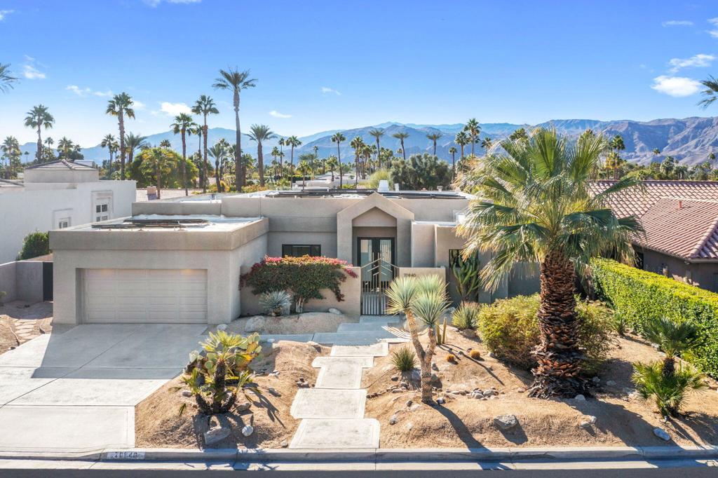Experience elevated living in this beautifully updated home, nestled in the prestigious Tamarisk neighborhood with no HOA dues. Offering breathtaking south-facing mountain views on a spacious .23-acre lot, this home is a serene retreat with luxurious upgrades.Enter through a custom iron gate into a tranquil courtyard and step into a light-filled interior featuring soaring ceilings, clerestory windows, and a modernized 3-sided fireplace that anchors the open living spaces. The recently remodeled kitchen is a chef's dream, showcasing sleek cabinetry, updated countertops, and high-end finishes, complemented by a cozy breakfast nook with sliders to the outdoor living area.The primary suite serves as a private haven with a spa-like ensuite bath, dual sinks, and a walk-in closet. A guest bedroom features its own ensuite bath, while the third bedroom provides flexibility as a home office or additional sleeping space. New designer light fixtures throughout add a contemporary touch.Enjoy the outdoors with a sparkling new pool, a serene water feature, and ample space to create your dream backyard oasis. The expansive side yard offers endless potential for additional living space, a sport court, or other custom enhancements.Ideally located just minutes from Mission Hills Country Club, upscale shopping, fine dining, and premier entertainment, this home blends modern luxury with the timeless beauty of Rancho Mirage's stunning surroundings.