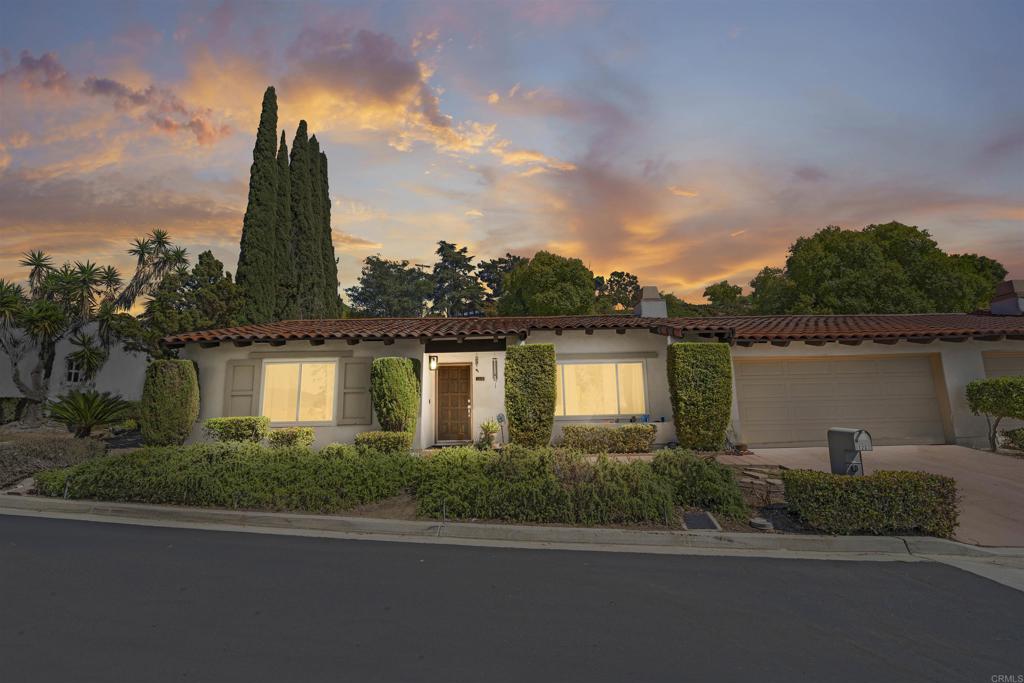 Rarely available in desirable Buena Ventura! Welcome home to the coveted Country Club neighborhood of Escondido this Spanish inspired 2 bedroom 2 bathroom home is ready to meet its new owner! Perched high on La Paloma glen, you will enjoy beautiful north westerly views, gorgeous sunsets, and cool breezes that flow into the home daily. Upon entry you will be greeted by a spacious great room with its exposed wood beam and vaulted ceiling. The generous number of windows flood the interior with natural light. The primary bedroom offers an ample walk-in closet and ensuite bathroom. The second bedroom offers a spacious closet with built in shelving and mirrored sliding doors. The galley kitchen is an efficient space to cook in with its gas cook top, stainless steel oven and microwave, Z-Line dishwasher and tons of cabinets for storage. Just off the kitchen you will have access to the 2 car attached garage, laundry area with gas dryer hook up. The back garden area offers a patio space perfect for outdoor entertaining and al fresco dining. Roof completed in summer of 2023 with 50 year titanium synthetic underlayment. The beautiful Buena Ventura community is famous for its lush landscaping, mature tree complex, and privacy. It offers a community pool, spa, barbecue area, tennis courts, and plenty of green space to enjoy with your family and furry friends!