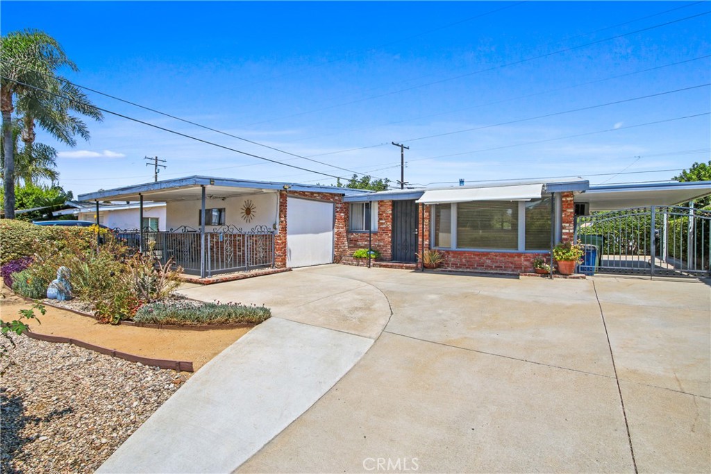 Welcome to this adorable 5-bedroom, 2-bath home perfectly located near schools, shopping, and convenient access to the 210 Freeway. Step inside to a spacious open-concept living room and kitchen, ideal for gathering and entertaining. The expansive primary suite offers a cozy fireplace and private bathroom, with the flexibility to serve as a separate living area—perfect for multi-generational living. Each bedroom features ceiling fans for added comfort. Enjoy the convenience of an indoor laundry room and a lush, private backyard with no rear neighbors—your own serene retreat. There's ample space to relax, garden, or play, plus two storage sheds offering plenty of extra storage. Don't miss your chance to own this delightful home—schedule your showing today before it's gone!
