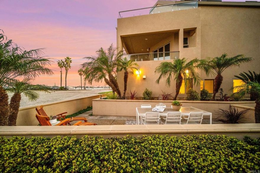 This custom-renovated, single-level beachfront home delivers the ultimate relaxed coastal lifestyle and is perfectly perched right on the sand of Mission Bay offering a smart mix of luxury and livability — perfect for a primary residence, second home, or vacation rental. The chef’s kitchen dazzles with stunning new stone countertops, designer shaker cabinetry, and premium appliances all opening to the sun-filled great room with floor to ceiling glass framing those jaw-dropping bay views. Elegant white oak plank flooring runs throughout and sleek designer finishes in the elevated baths add to the cozy coastal charm.  Expansive outdoor patio offers the finest in indoor/outdoor living highlighting a built in BBQ and luxury landscaping.  This is the dream lifestyle you’ve been waiting for with sunshine, sailboats, and SeaWorld fireworks lighting up your nights. Sip morning coffee with your toes in the sand or toast the sunset with friends as the bay sparkles before you. Rounding out this dream home is central a/c and heat, washer/dryer, and plenty of parking — 2-car tandem carport plus one flex space. Steps to Yacht Club, restaurants, coffee shops, boutiques and so much more!