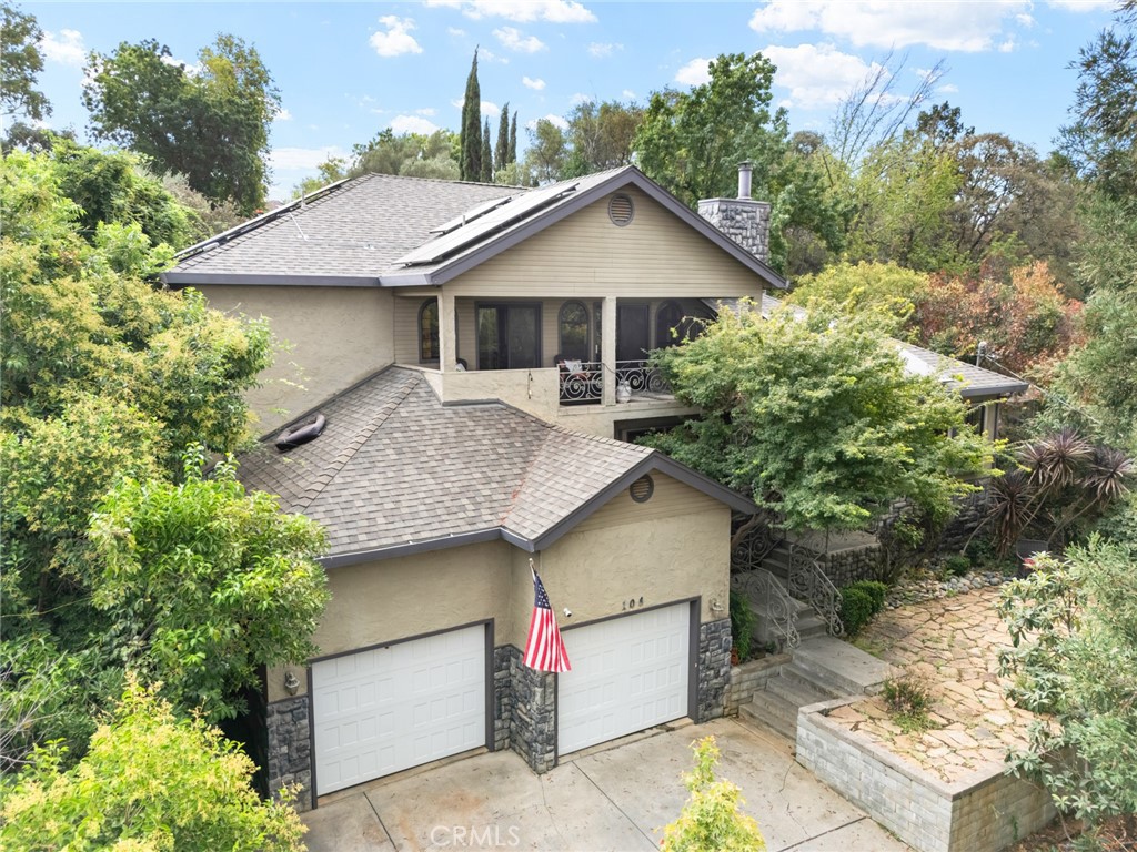 This spacious 4-bedroom, 3-bath home offers over a quarter acre of comfortable living space just minutes from downtown and the lake. Designed with both style and functionality in mind, the home features vaulted ceilings with stunning open wood beams, creating a warm and inviting atmosphere throughout. Inside, you’ll find a thoughtfully designed layout that includes two bonus areas (another possible bedroom or large office) The kitchen is well-appointed, opening seamlessly to the dining and living area's as well as the back yard, for easy entertaining. Step outside and enjoy your own private retreat. A sparkling in-ground pool waits for summer relaxation. In the front of the home, the upstairs balcony offers elevated views and the perfect spot for morning coffee or evening sunsets. A big garage that is perfect for housing your vehicles, toys or for extra storage also has a loft and indoor laundry area. For energy efficiency the home also has owned solar and, in the winter, stay warm by the wood stove. Most appliances, ice machine & hot tub are included. With its blend of charm, functionality, and outdoor enjoyment, this home is truly a retreat.