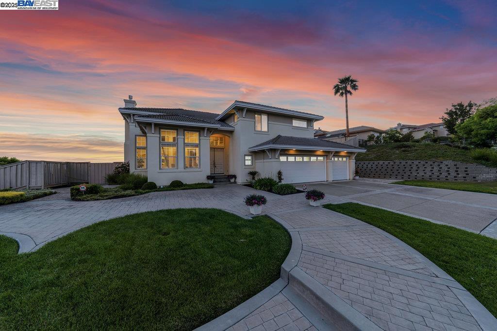 Expanded to perfection & East facing this Bay Area dream home is located in the prestigious Ponderosa Heights Gated Community*Luxurious 6 bedroom estate offers grand living & breathtaking views*Enter through a dramatic foyer featuring soaring high ceilings*oversized tile flooring*sweeping curved staircase*Enjoy a private office w/custom wood bookcases w/ladder*The living room boasts soaring high ceilings*sunlit windows*gas fireplace w/marble surround*elegant wall niches*The chef’s kitchen features rich cherry cabinets, granite countertops, center island, barstool seating, walk-in pantry, & premium appliances—incl. a built-in KitchenAid fridge, double ovens, Dynasty 6-burner gas range, & more*Entertain at the step-down granite bar or relax in the family room w/custom cabinetry & fireplace*Movie nights shine in the dedicated theater w/plush carpet, dual-level seating, & built-in surround sound*A first-floor bedroom & bath en-suite adds convenience*Primary suite stuns w/hardwood floors*vaulted ceilings*fireplace*panoramic Bay views*Its spa-like bath incl. dual vanities*sunken jetted tub*skylights*custom walk-in closet w/organizers*Enjoy outdoor living with a covered patio, lush lawn, spectacular views. Luxury, comfort & California charm*