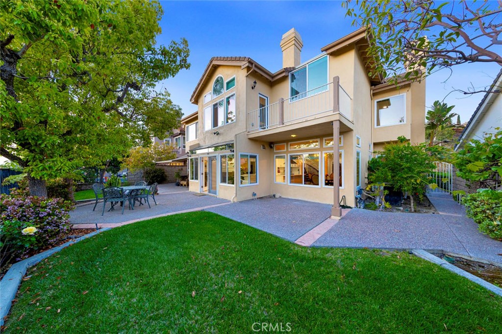 Welcome to one of the most exclusive streets in the already highly sought after guard gated community of Canyon Crest right above the beautiful Lake Mission Viejo. Your ability to buy a house on this street has only been in your dreams! This family home has 4 bedrooms and 5 bathrooms with a very tranquil backyard overlooking Lake Mission Viejo. Furthermore, this floor plan includes a downstairs bedroom with an en suite bathroom. The kitchen has been remodeled in the last year with solid wood cabinetry, quartz countertops, and stainless steal appliances. The house comes equipped with a 3 car garage and 3 driveway spaces for plenty of parking. Have a golf cart? Use it to drive to the Clubhouse, 1 of 3 swimming pools, tennis courts, BBQ area, picnic area, gym, and so much more that the community HOA offers! Go a few blocks outside of the guard gated community and you will be at Lake Mission Viejo! Your view becomes your playground with swimming, fishing, boating, and other great family activities! Don't wait, make this your new home in the incredible Canyon Crest community before it's gone.