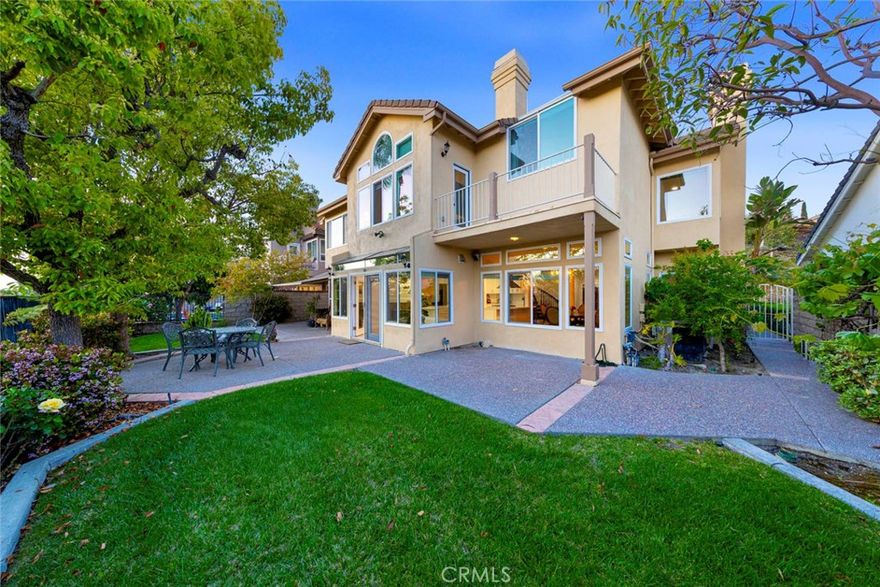 Welcome to one of the most exclusive streets in the already highly sought after guard gated community of Canyon Crest right above the beautiful Lake Mission Viejo.  Your ability to buy a house on this street has only been in your dreams!  This family home has 4 bedrooms and 5 bathrooms with a very tranquil backyard overlooking Lake Mission Viejo.  Furthermore, this floor plan includes a downstairs bedroom with an en suite bathroom.  The kitchen has been remodeled in the last year with solid wood cabinetry, quartz countertops, and stainless steal appliances. The house comes equipped with a 3 car garage and 3 driveway spaces for plenty of parking.  Have a golf cart?  Use it to drive to the Clubhouse, 1 of 3 swimming pools, tennis courts, BBQ area, picnic area, gym, and so much more that the community HOA offers!  Go a few blocks outside of the guard gated community and you will be at Lake Mission Viejo!  Your view becomes your playground with swimming, fishing, boating, and other great family activities!  Don't wait, make this your new home in the incredible Canyon Crest community before it's gone.