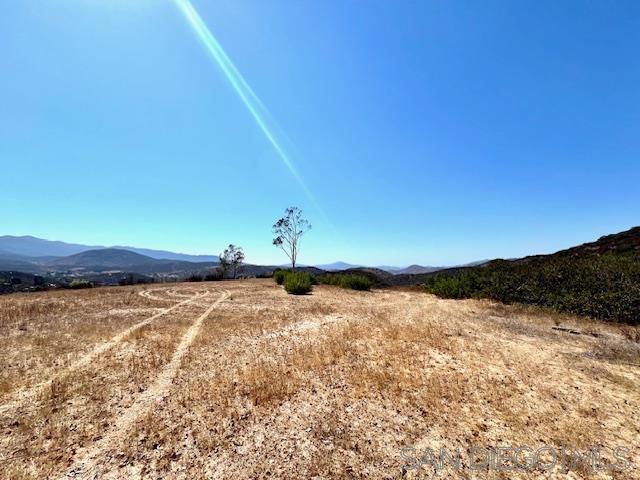 Discover the perfect blend of privacy and convenience with this 8.88 acre parcel featuring breathtaking mountain views. It includes a large area of usable flat land that provides the ideal setting to build your custom home. Located in Dulzura, this land offers easy access—only 15 minutes to Jamul and 25 minutes to Chula Vista’s Eastlake Community. Utilities are close by with electricity nearby and an existing water well on the property. Everyday essentials are within reach with a local post office, general store, and restaurant just minutes away. An excellent opportunity to create your dream home surrounded by nature while still being close to modern conveniences.