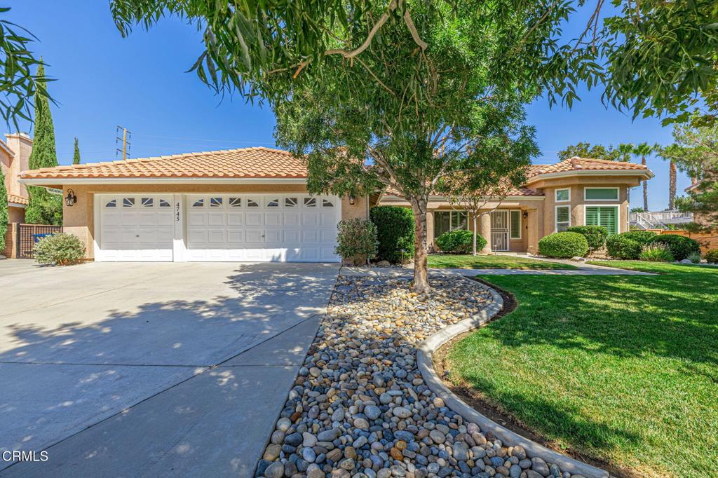 Discover this exquisite Stratford Ranch home tucked away on a quiet cul-de-sac in one of the area's most sought-after neighborhoods in West Palmdale. From the moment you arrive, you'll be impressed with the striking curb appeal and timeless design. Step inside to find light-colored luxury vinyl plank flooring, recessed lighting, upgraded fixtures, and window shutters that create a bright and welcoming ambiance throughout. The chef's kitchen is a true showpiece with granite countertops, upgraded cabinetry, new high-arc Moen faucet, a breakfast bar, charming garden window, and brand-new stainless-steel appliances. Perfect for entertaining, the home offers a formal living room, formal dining room, and a spacious family room with a cozy gas fireplace. The master suite is your private retreat, complete with double doors leading to the patio, mirrored closet doors, a large walk-in closet, and a spa-like master bath featuring dual vanities, a new shower, and a freestanding oval soaking tub set beside a fireplace insert for the ultimate in relaxation. Additional highlights include central HVAC plus an energy-efficient evaporative cooler with separate ducts, new windows (installed in 2018), ceiling fans throughout, and a separate laundry room. The oversized 3-car garage comes finished with epoxy floors and built-in cabinetry, while the backyard is designed for gatherings with decorative curbing, lush landscaping, a full-length covered patio, large RV pad and amazing nighttime views. With its tile roof, elegant upgrades, and ideal location near shopping, dining, and top-rated schools, this remarkable home truly offers the best of Stratford Ranch living--inside and out.