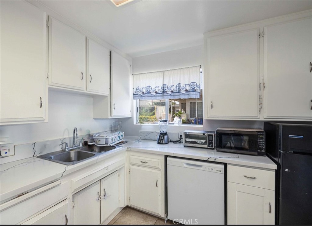 Investment Gem in Garden Grove!
Welcome to this rare opportunity—a 2,060 sq ft single-family home on a massive 8,422 sq ft lot, featuring approved plans for a 1,200 sq ft ADU and a detached garage with JADU conversion potential—ideal for maximizing rental income. Currently generating $4,800/month on a month-to-month lease, the property features new flooring and also a new garage roof. Its prime location near major freeways, top schools, Disneyland, and shopping centers makes it ideal for both long-term appreciation and strong CASH FLOW. Whether you’re looking to live in one unit and rent the other, house multiple generations, or expand your investment portfolio, this is a must-see opportunity. Don’t miss out - schedule your showing TODAY