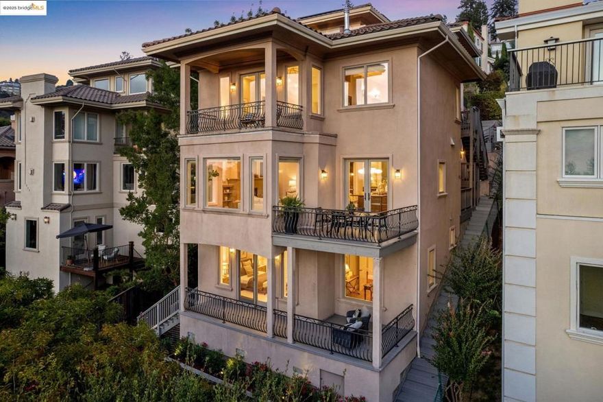 Welcome to 9047 Broadway Terrace, a high-tech residence where modern design and comfortable living converge. Soaring ceilings, gracious proportions, and views of the Bay create a peaceful retreat with the plus of a home elevator. This home boasts 6 generous bedrooms and 4.5 baths, including a primary suite with walk-in closet, expansive primary bath with jetted-tub and two-sided gas fireplace, and an elegant bedroom with balcony. The gourmet kitchen features soapstone countertops, two sinks, high-end appliances, and a large island that is perfect for casual meals or chic gatherings. The kitchen opens to a view deck, perfect for al fresco dining or taking in the Bay view. A large living room with a fireplace and picture windows is the ideal space for relaxation or entertaining, while a separate family room offers flexibility for movie watching, sleepovers, or game nights. Need a separate space to work? A private office is tucked away for concentration & creativity. The outdoor areas are equally inviting, featuring view decks and a lush lawn. Experience elevated living with thoughtful amenities: AC, 1 gig fiber internet, intercom, solar, networking and security systems, and smart electrical panels. Close to Montclair Village. Make this exceptional property yours!