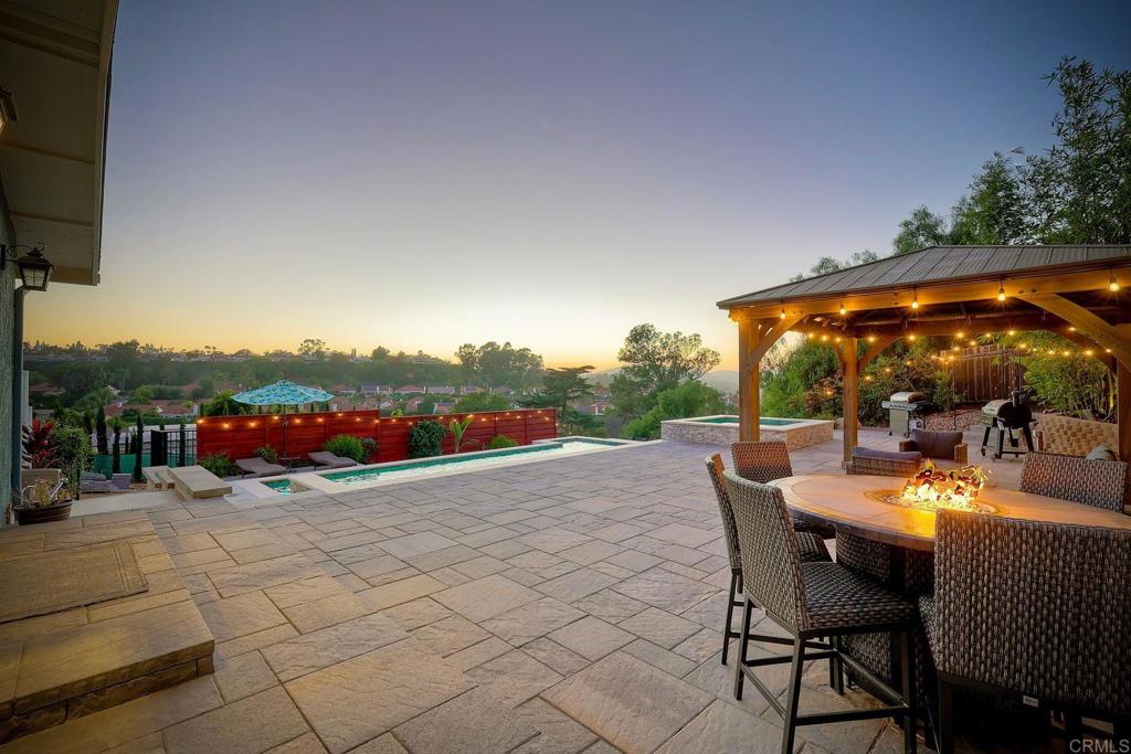 Ranch style spacious 4-bed, 2-bath home offers light-filled living spaces, upgraded kitchen and bathrooms, and a primary suite with en-suite bath. The backyard is an entertainer’s dream, featuring a sparkling pool and spa with smart controls, expansive patios, a play lawn, and plenty of room for gatherings. With owned solar, energy-efficient systems, and a location in the award-winning Poway Unified School District, this property is move-in ready and designed for modern living.