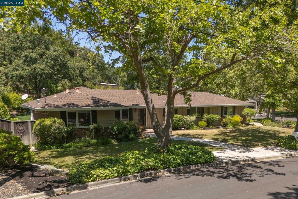 Location, location, location! Tucked away in the highly desirable Parkmead neighborhood this charming 4 bedroom home is situated on a most spectacular parklike flat .52 acre lot. The remodeled kitchen features stainless appliances and granite counters, two pantries, while the remodeled bathroom boasts Carrea marble finishes. Upgrades include newly refinished hardwood floors, some interior painting, new bedroom ceiling fans and lights and dual pane windows. The rear grounds are incredibly peaceful with lush lawn and gardens, multiple seating areas, a gazebo, room for pool, sport court, ADU and more! All just minutes from Downtown Walnut Creek and sought after schools!