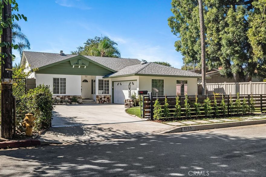 Nestled on one of Valley Village’s most sought-after blocks, this residence blends updated modern style with just the right hint of mid-century charm. This beautiful 3-bedroom, 2-bath home offers over 2,300 square feet of well-appointed living space with a fresh new look!



From the moment you walk in, you're greeted by free-flowing space where modern design meets everyday comfort. The open floor plan effortlessly blends the living, dining, and family room extension, offering an ideal setting for hosting friends or sharing family moments. Whether you’re entertaining in the spacious indoor-outdoor living areas or enjoying a quiet evening by the fireplace, this home offers a perfect balance of style, function, and sophistication.



The galley-style kitchen caters to those who love to cook, featuring plenty of counter and cabinet space, range, microwave, dishwasher, trash compactor, newer refrigerator, and a greenhouse window. Off the kitchen, you'll find an updated bath and a mudroom, perfect for reducing clutter in the home.



The primary suite boasts a spacious lounging area, walk-in closet, and access to the backyard. Two additional rooms and a full bath are located off the hallway. One bedroom includes the bonus of a custom professional-grade sound studio designed by Evolve Acoustics, ideal for podcasters, music producers, VO artists, or anyone seeking a quiet, creative retreat.



Outdoors, experience true Southern California living with a sparkling heated swimming pool, eco-friendly grass, pergola with retractable canopy and TV closet, complete with a retractable shading system that provides ultimate comfort during sunny days. The large driveway offers plenty of parking and a 2-car attached garage.



Some of the many upgrades performed within the last 10 years include the HVAC system (ducts and insulation) and a 200-amp panel. More recent updates include new interior and exterior paint, updated landscaping, some lighting, newer refrigerator, partial roof replacement, and more.



Minutes to Burbank Blvd Elementary, Walter Reed Middle, and North Hollywood High. Dine at local favorites like Harvest Moon Kitchen, Compelling Coffee, Pacific Kosher, Vivi, Tel Aviv Grill, and Hugo’s. Shopping options include Gelson’s and NoHo West. Located minutes from Studio City, Toluca Lake, and major studios, this Valley Village gem blends comfort, creativity, and sophistication in one unforgettable home.
