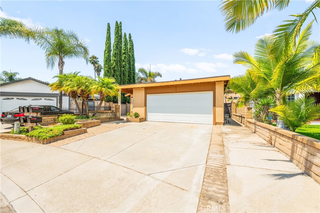 Experience the exceptional opportunity to lease this a SINGLE-LEVEL residence in the highly sought-after Cordova South community of Mission Viejo. This inviting home features three bedrooms, two bathrooms, and 1,584 square feet of living space. Highlights include soaring vaulted ceilings, a generous family room, and a kitchen adorned with new quartz countertops that seamlessly connects to the dining area. Both bathrooms have been elegantly remodeled, while the primary suite boasts an en suite bath and a versatile office or sitting area. A distinctive permitted entryway allows for direct access to the garage, and the low-maintenance backyard—complete with a spa, an expansive side yard, and a permitted elevated deck—offers stunning panoramic views of the hills, mountains, city lights, and fireworks displays. Additional features encompass recessed lighting in both the kitchen and living room, dual-pane windows and sliders, an energy-efficient HVAC system, instant hot water circulation, and an outdoor storage shed. The property is conveniently located just a short two-minute walk from the highly regarded Carl Hankey Elementary School, rated 9/10 by GreatSchools.org, and qualifies for Lake Mission Viejo HOA membership, all within close proximity to parks, schools, shopping, and dining options.