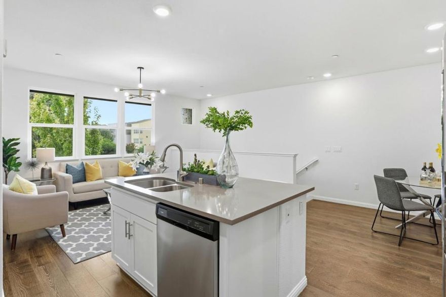 Immaculate and contemporary townhome in the central location of the desirable Onyx community. Bright and cheerful home with abundant large picture windows bringing soothing natural light. Open and functional floor plan decorated in designer's choice colors. Classy and quality engineering wood floor through the living area. Sizable kitchen with ample white Shaker cabinets, expansive quartz counters and stainless steel appliances. Large central island with a convenient breakfast bar. Modern mid-century chandelier adorns the living area with elegance. Spacious master bedroom with walk-in closet and ensuite bath with double sink vanity and large shower place. Intimate deck from the master, seamlessly blending indoor and outdoor living with an open view. Each bedroom features a walk-in closet. Convenient and separated indoor laundry. Special features in this community include BBQ/picnic area and dog friendly park. Adjacent to the new city park Newbury Park with the variety of outdoor activities. Convenient location with short commute to downtown SJ, Japantown and shoppings including Costco, Ranch 99 & H-mart. Easy access to Bart, VTA and freeways 101/680. Walking distance to Google & Meta shuttle stops.