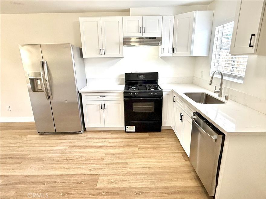 Beautifully Remodeled 2-Bed, 2-Bath Townhouse with Private Garage & Backyard. Experience modern living in this remodeled 2-bedroom, 2-bathroom townhouse-style unit, thoughtfully designed for comfort and style. Enjoy the convenience of a private 2-car garage, a separate laundry room, and your very own backyard oasis—perfect for relaxing or entertaining. Inside, you'll find new flooring and fresh paint throughout, creating a bright and inviting atmosphere. The gourmet kitchen has been completely updated with quartz countertops, brand-new cabinets, modern fixtures, and new appliances—ideal for any home chef. Both bathrooms have been beautifully renovated with contemporary vanities, stylish counters, and updated fixtures, offering a clean and luxurious feel. The open and airy floor plan enhances natural light and flow, making this home feel spacious and welcoming. A perfect blend of comfort, privacy, and modern upgrades—don’t miss this move-in-ready gem!