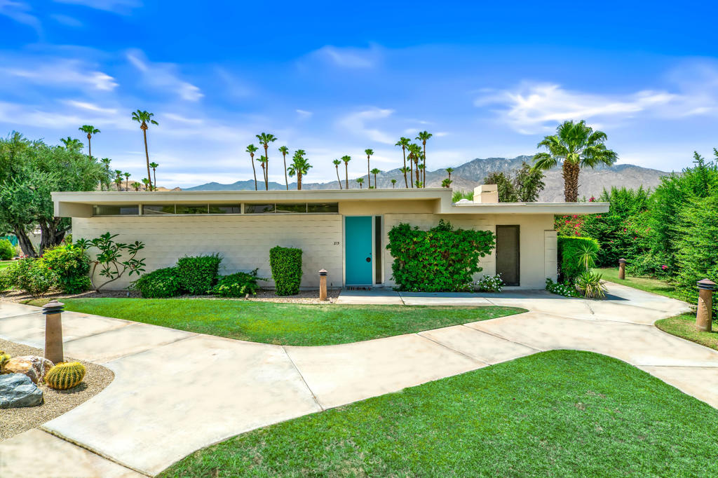 Enjoy the luxury of Seven Lakes Country Club living without the need to buy with this exceptional 12-month lease opportunity. Designed by the renowned architect Richard Harrison, this wonderful 2-bedroom, 2-bath, plus den condo, seamlessly blends indoor and outdoor spaces. The epitome of midcentury architecture with 10 foot walls of glass and clerestory windows, the home is flooded with natural light offering breathtaking mountain vistas. The Great Room includes a fireplace, custom bar, and built-in bookshelves. For the culinary enthusiast, the modern kitchen is equipped with stainless steel appliances and custom cabinetry. The large living, dining, and bedroom areas all open to a large patio, perfect for enjoying the peaceful surroundings. The Primary Bedroom includes an en-suite bathroom with double sinks and a spacious walk-in shower. Additional features include an in-unit washer and dryer plus a versatile bonus space for home office, storage, or gym use. Located on a quiet cul-de-sac, the home ensures privacy and tranquility. As a resident of Seven Lakes, indulge in 15 heated pools and spas, a Ted Robinson-designed golf course with awe-inspiring mountain views, tennis and pickleball courts, and the iconic William Cody designed clubhouse with restaurant, library. and bar. A 24-hour guarded gate offers added security further complimenting Seven Lakes' luxurious lifestyle filled with recreational opportunities. This condo is available either furnished or unfurnished, ready to welcome you to a relaxed and upscale desert lifestyle.